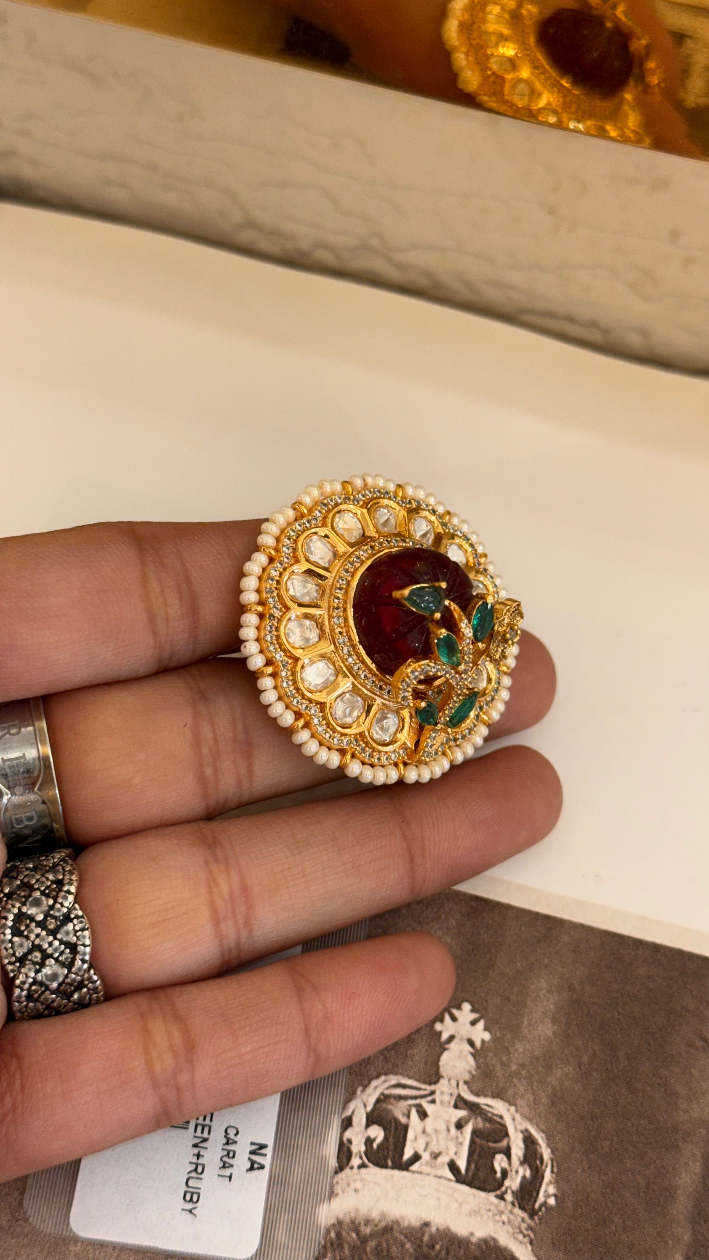 Ruby cocktail ring with leaf detailing