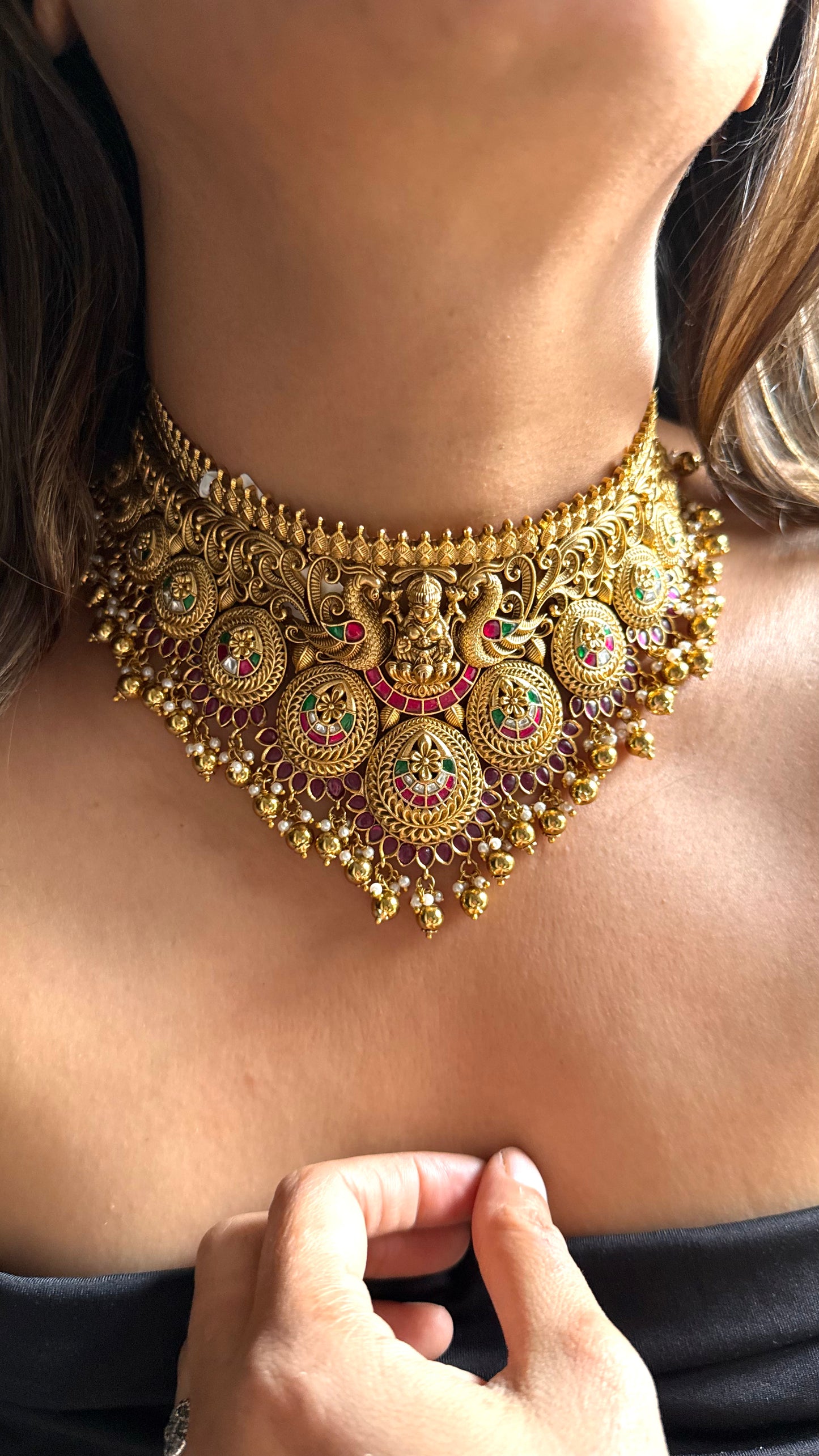 Goddess Laxmi inspired temple jewellery with peacock motif