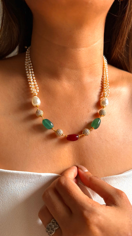 Emerald & ruby pearl string