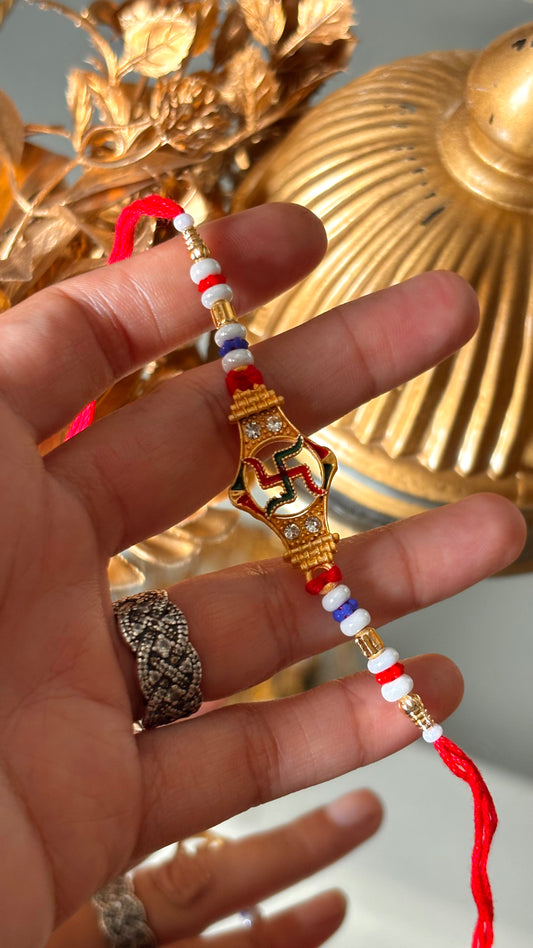 Swastik rakhi with red thread ( shipping will be extra )