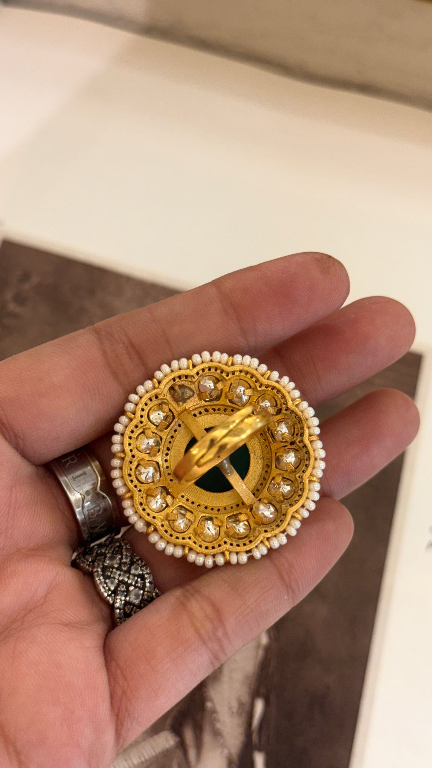 Ruby cocktail ring with leaf detailing