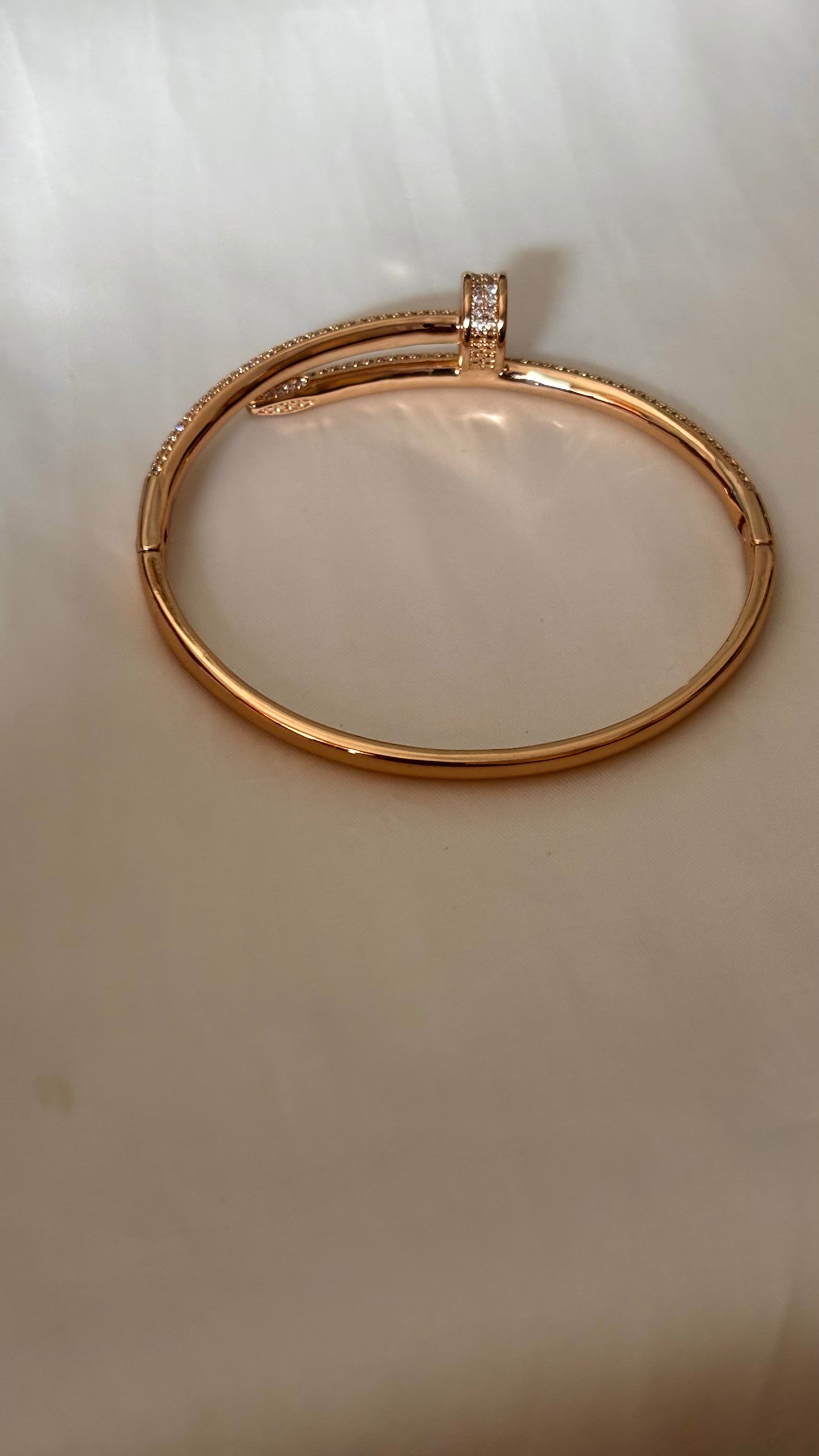 Crystal-Accented Nail rose gold tone bracelet
