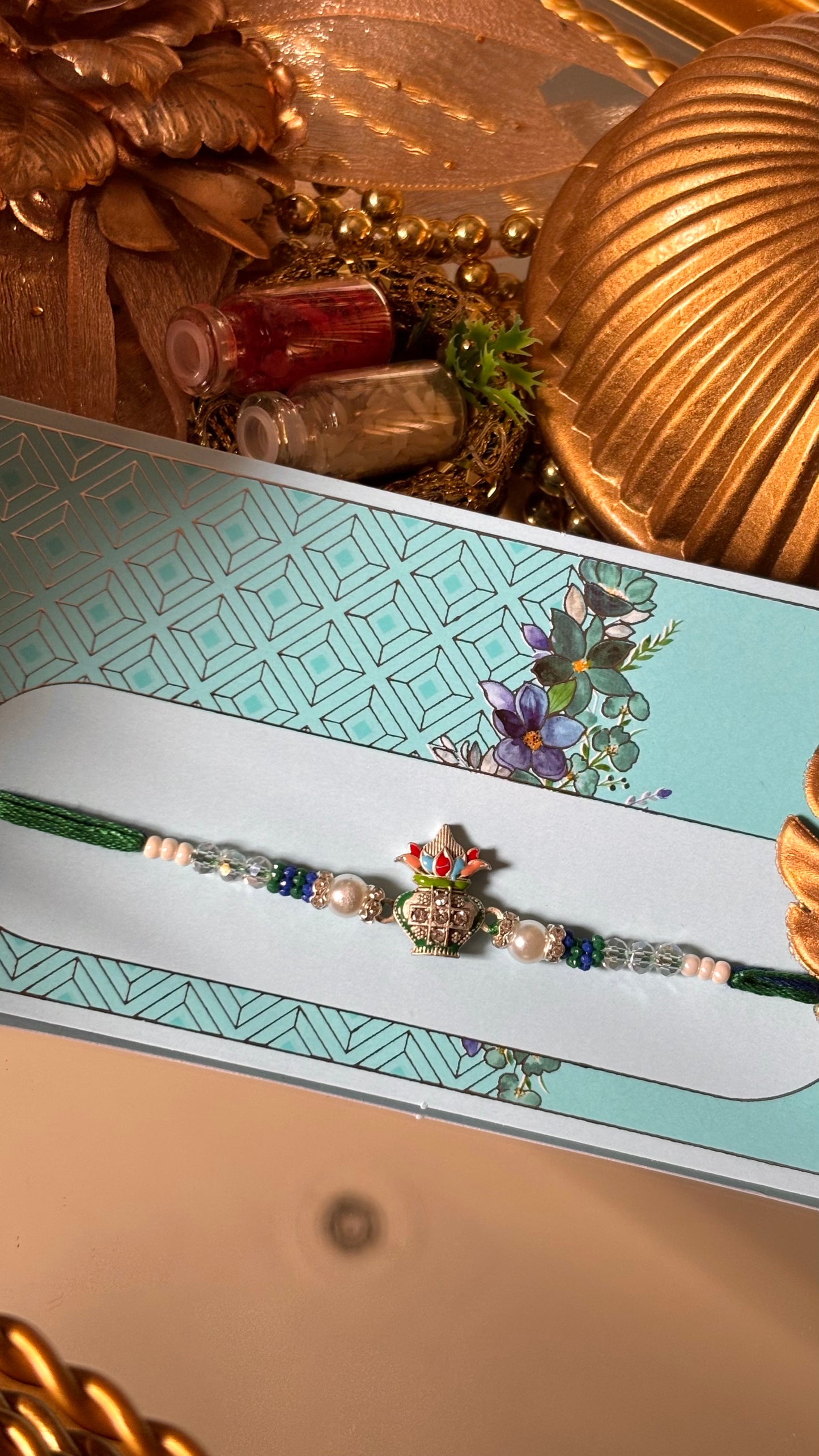 Kalash with pearl detailing rakhi ( shipping will be extra )
