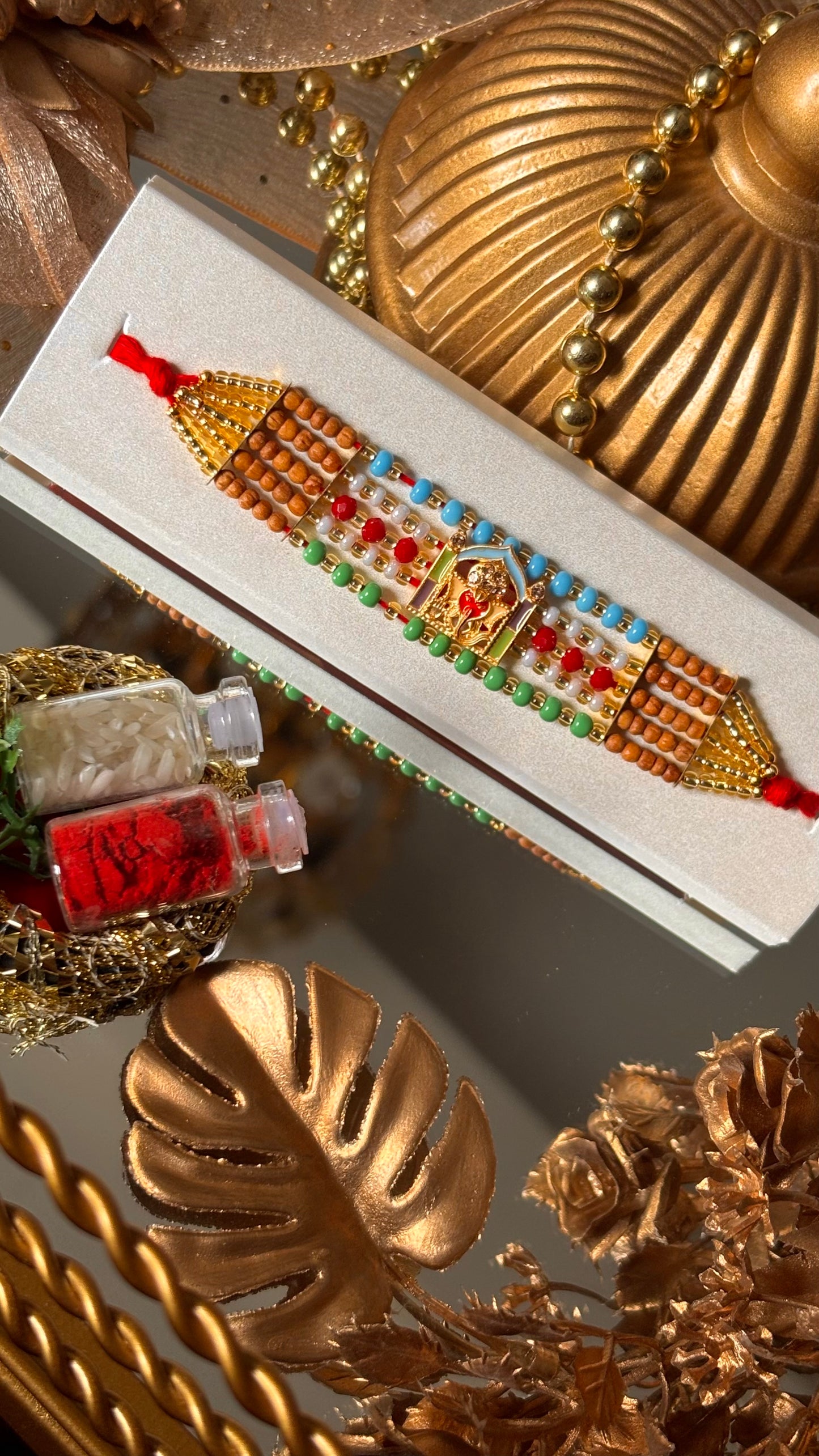 Lord ganesha multicoloured rakhi ( shipping will be extra )