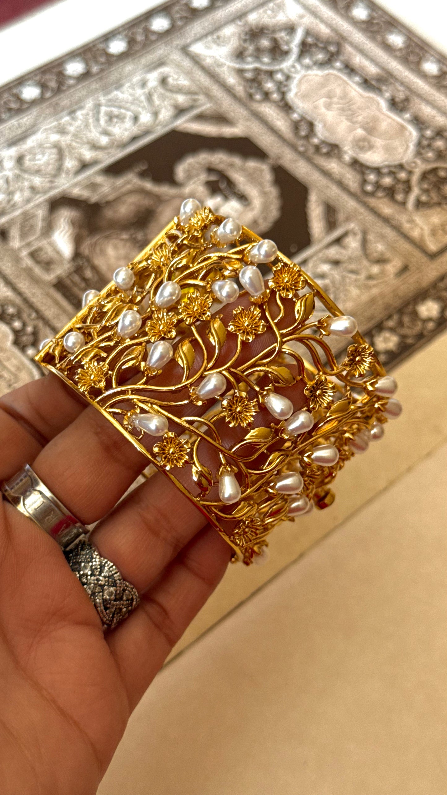 Pearl designer bracelet with gold Nakshi