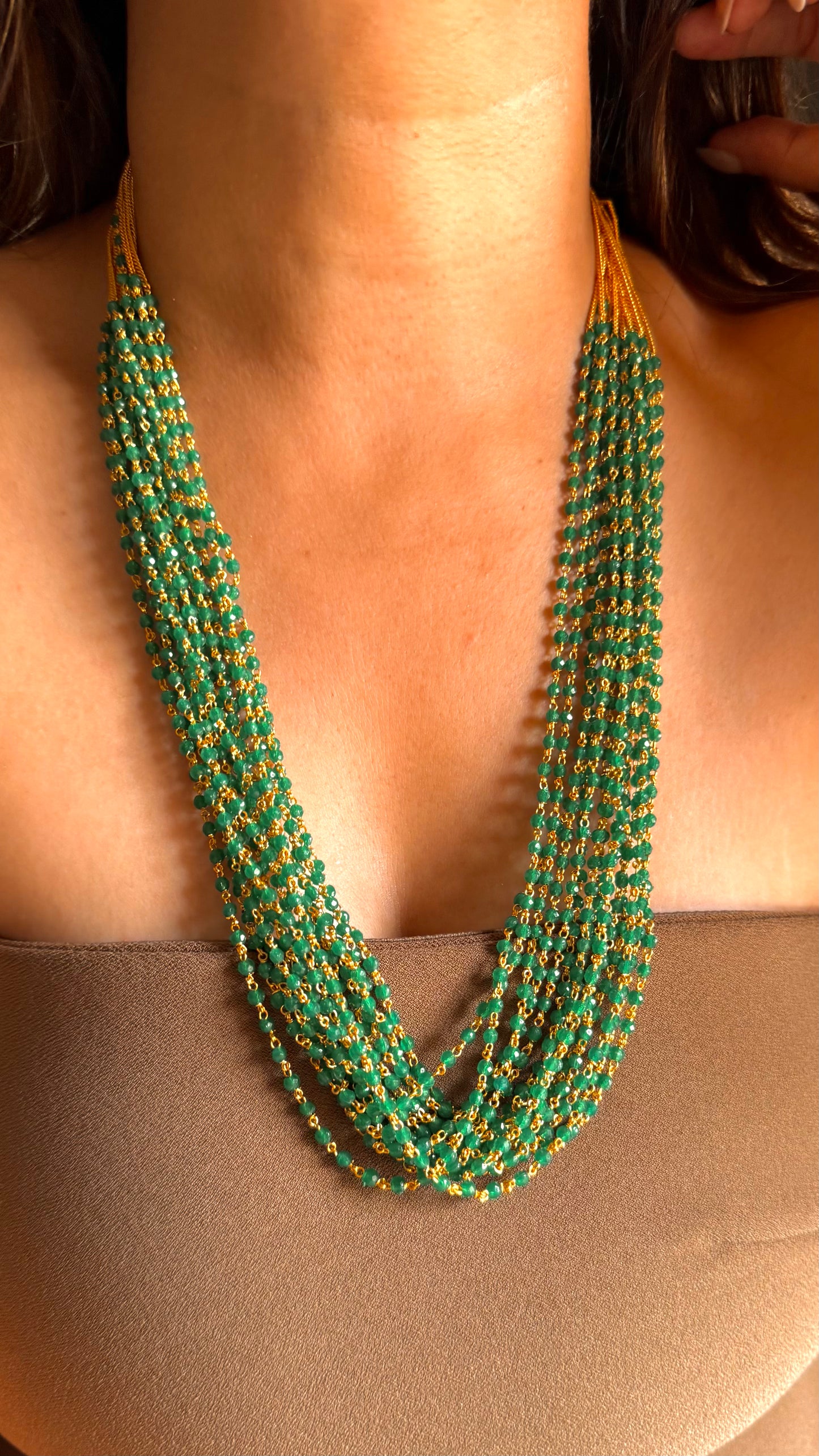 Multiple layer emerald string