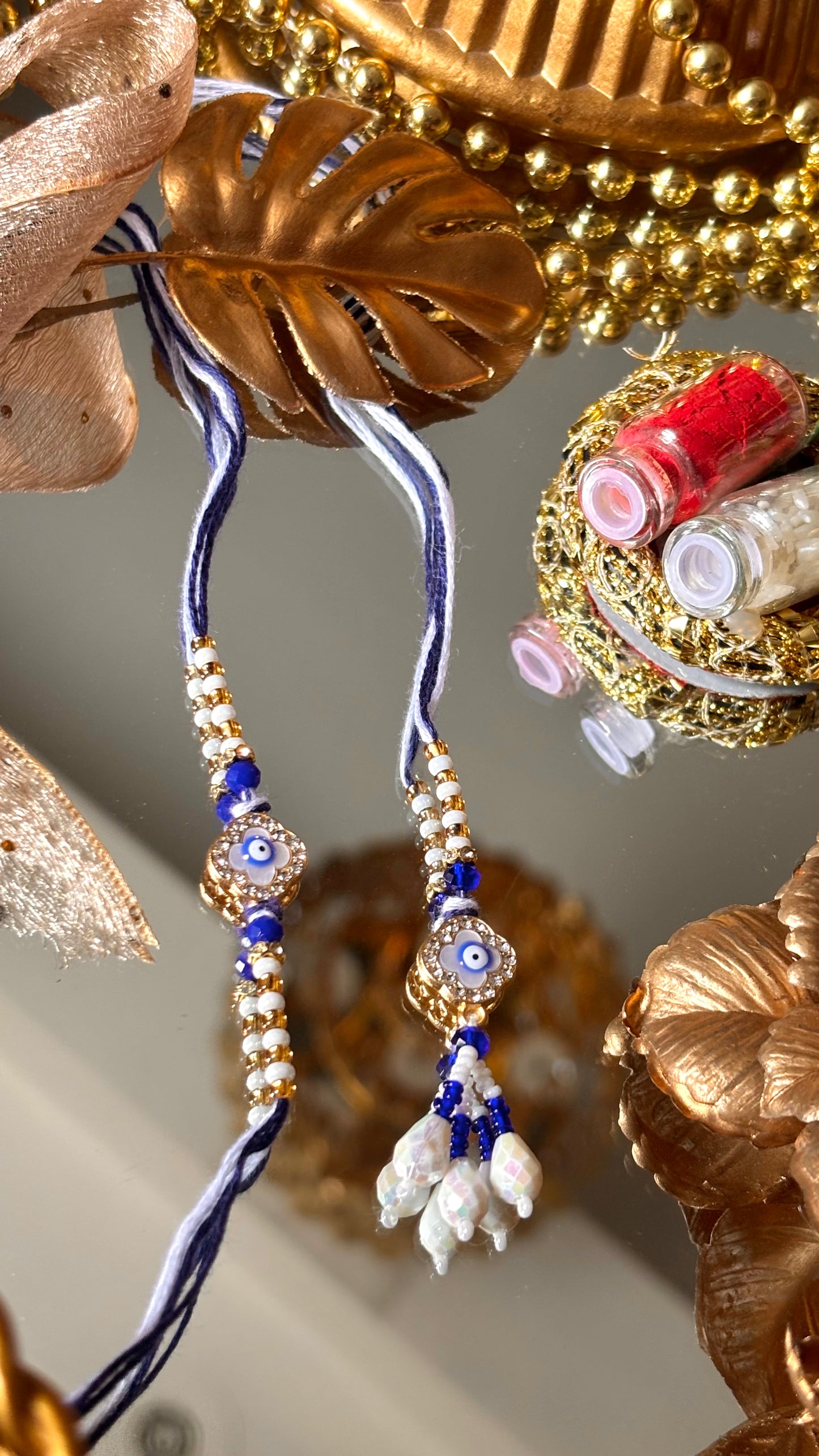 Evil eye vancleef inspired with pearl detailing couple rakhi ( shipping will be extra )