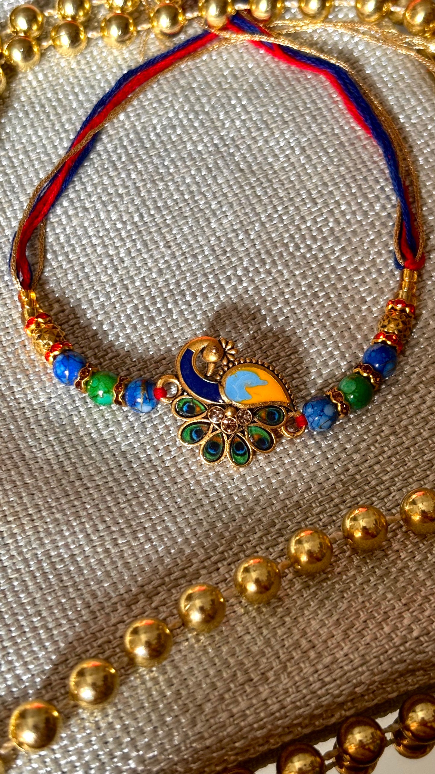 Peacock designer minimalist rakhi ( shipping will be extra )