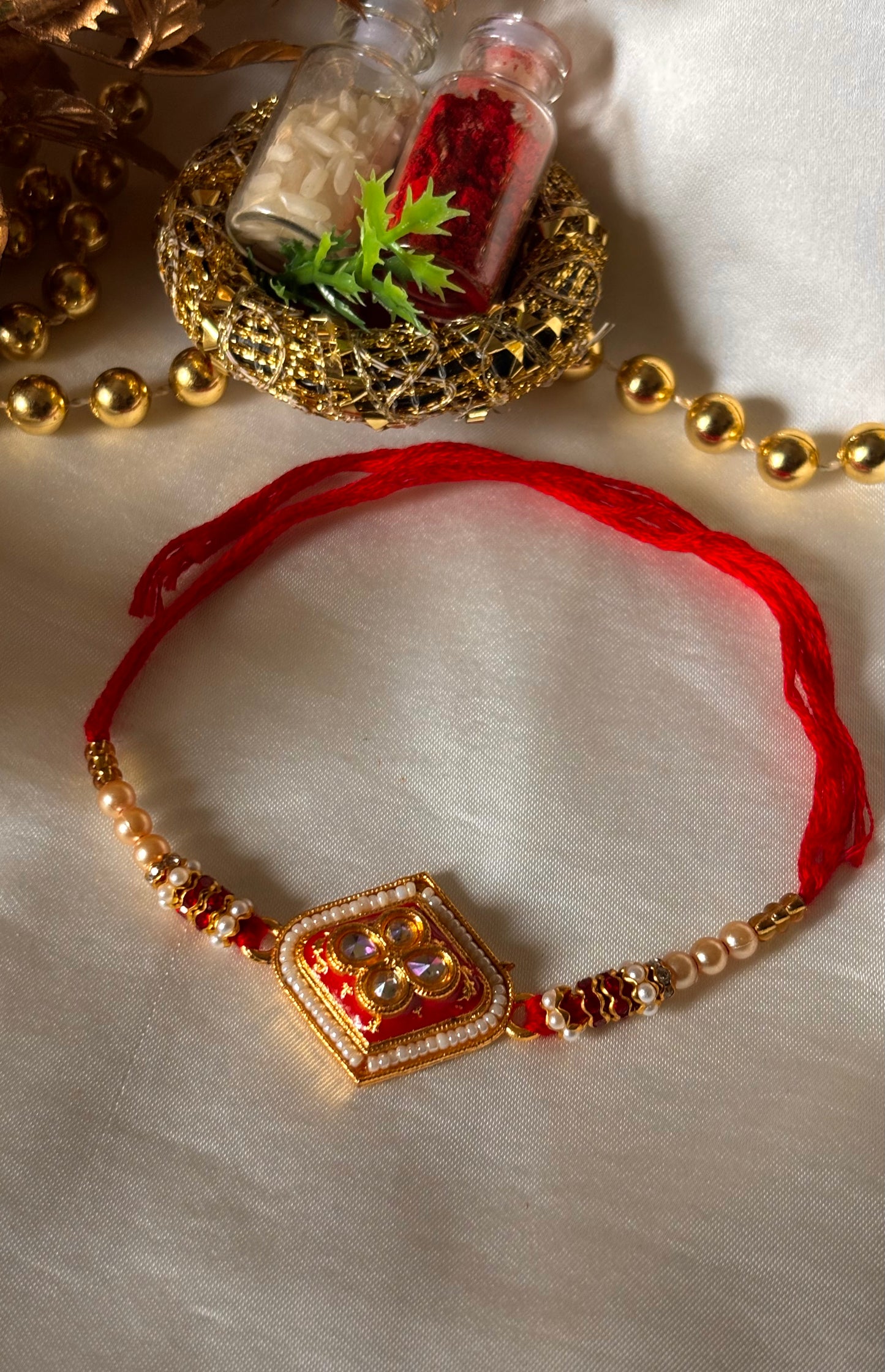 Red meenakari Kundan rakhi ( shipping will be extra )
