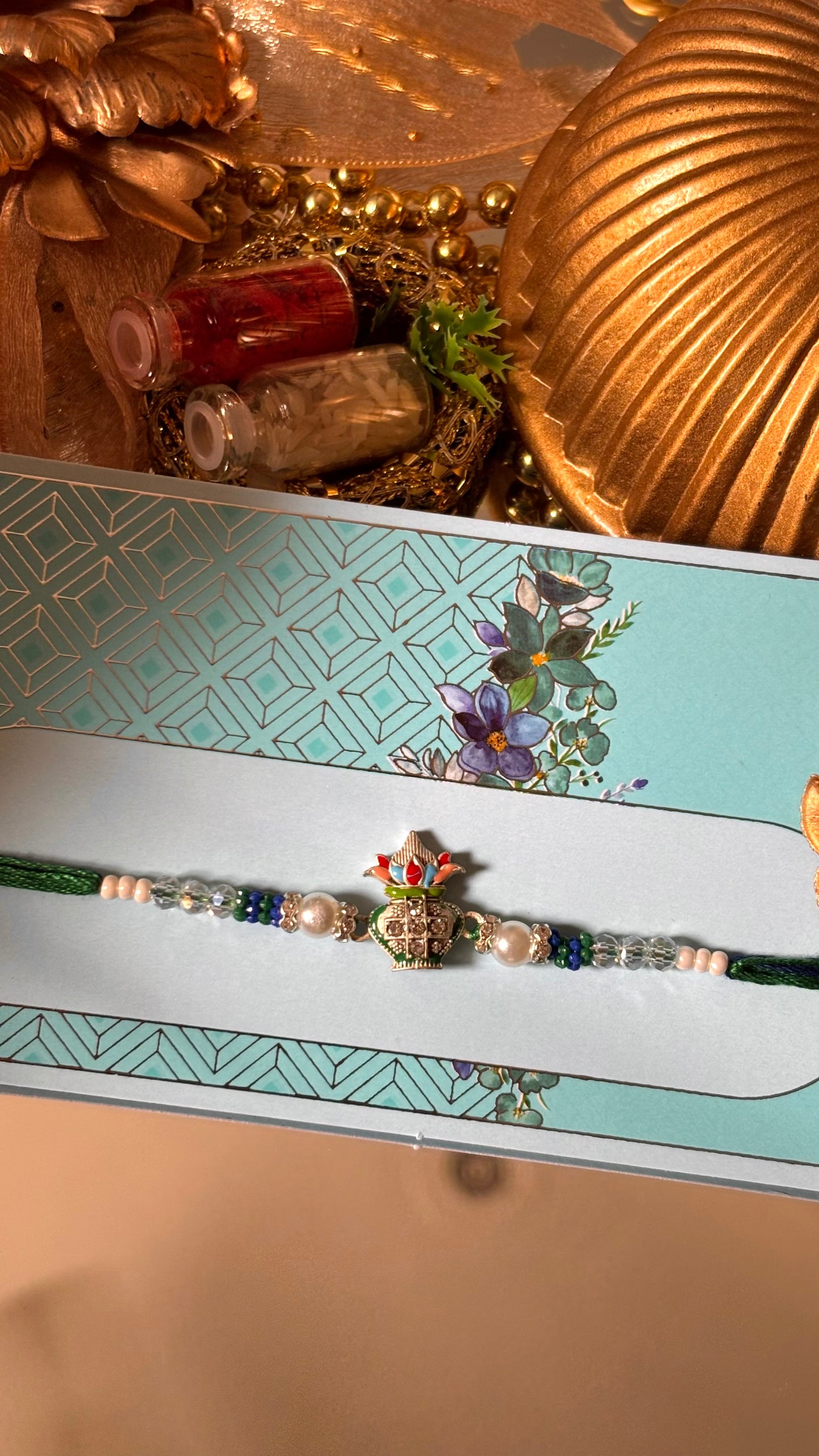 Kalash with pearl detailing rakhi ( shipping will be extra )