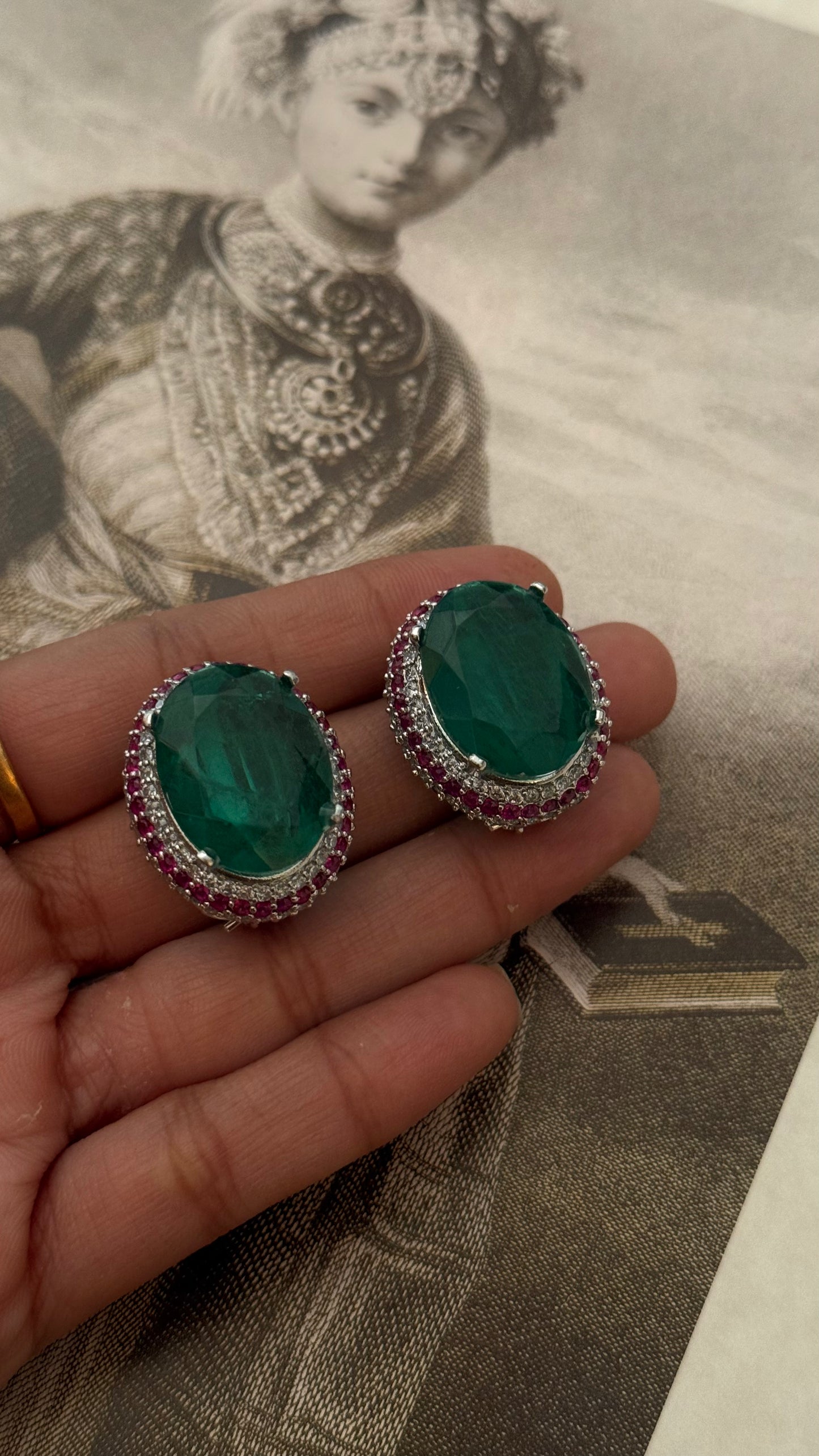Emerald studs with ruby lining (Silver polish)