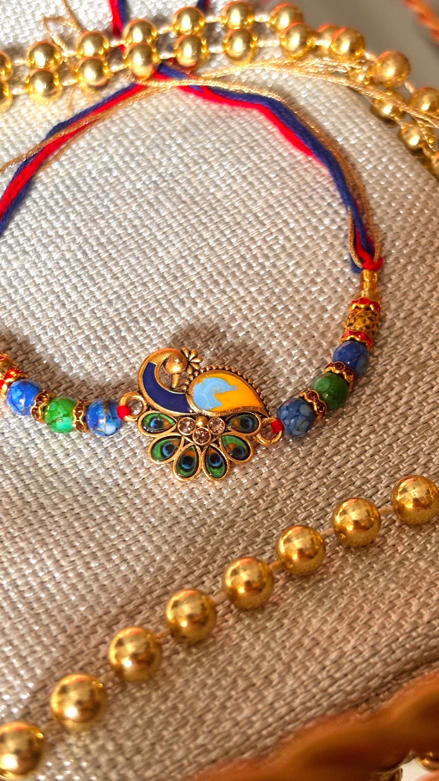 Peacock designer minimalist rakhi ( shipping will be extra )