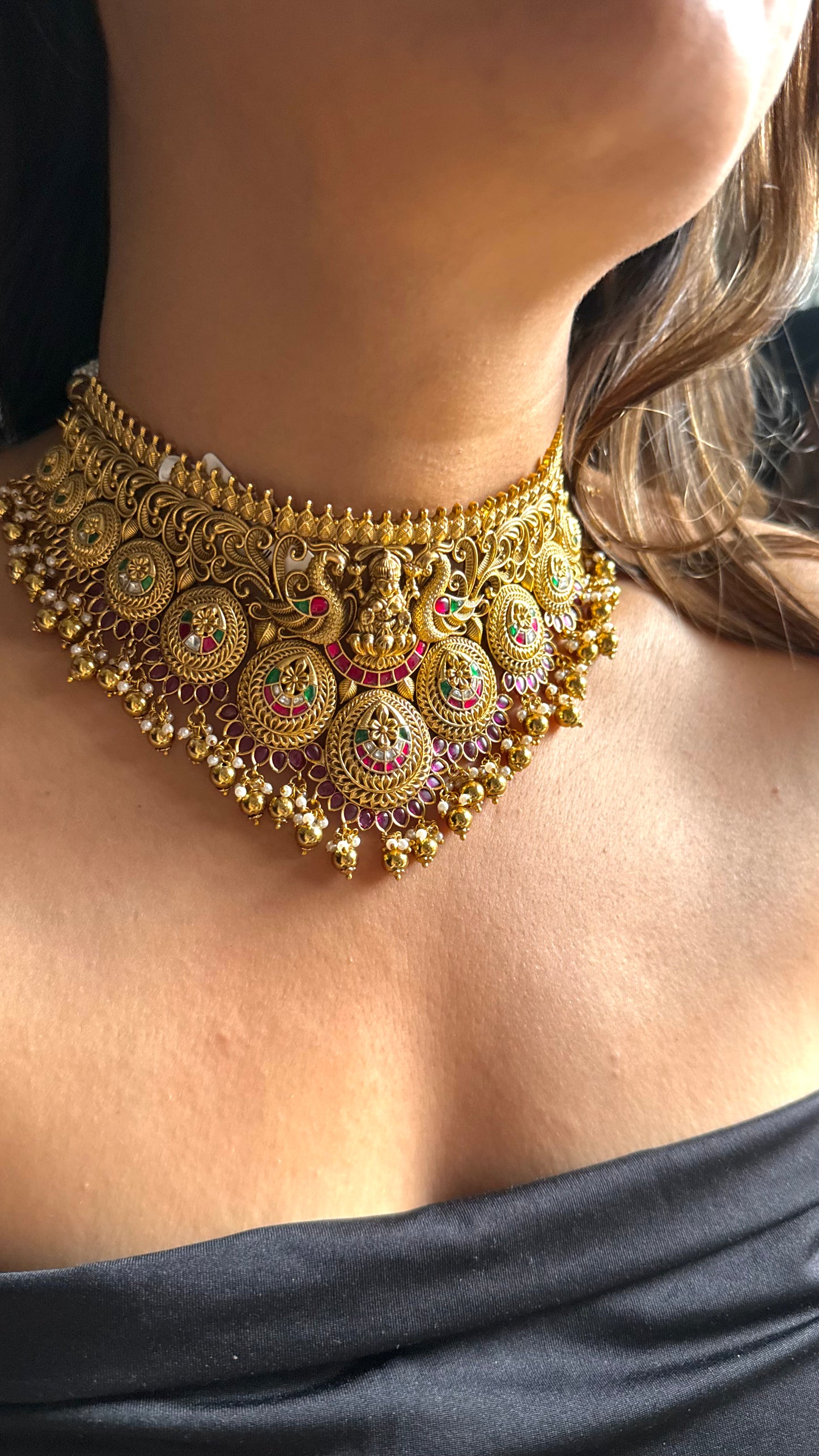 Goddess Laxmi inspired temple jewellery with peacock motif