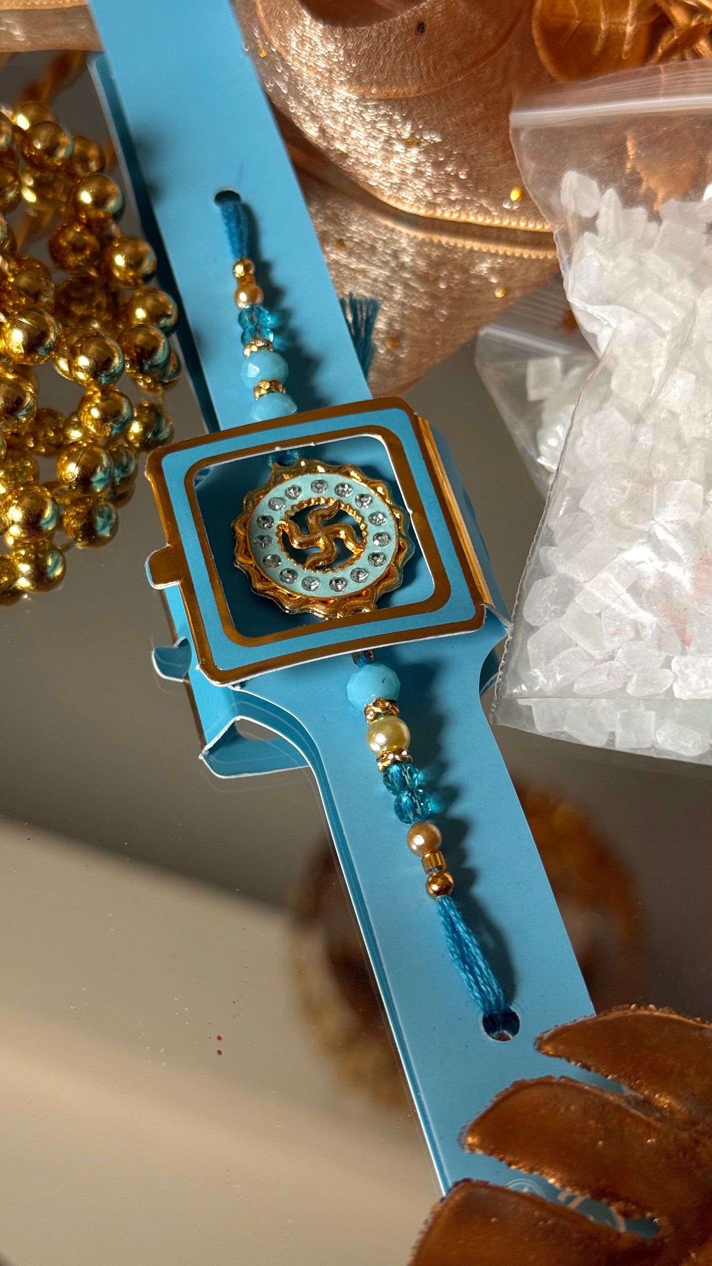 Swastik Rakhi (sapphire)