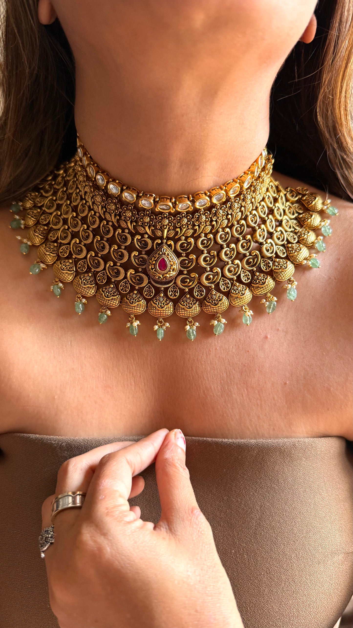 Ambi nakshi oxidised gold choker with ruby and mint detailing