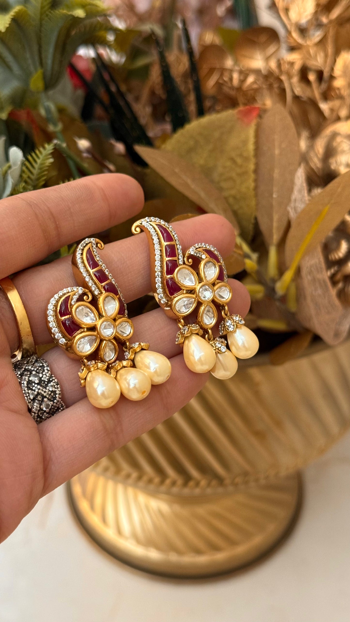 Designer Ruby takkar studs with floral pearl detailing