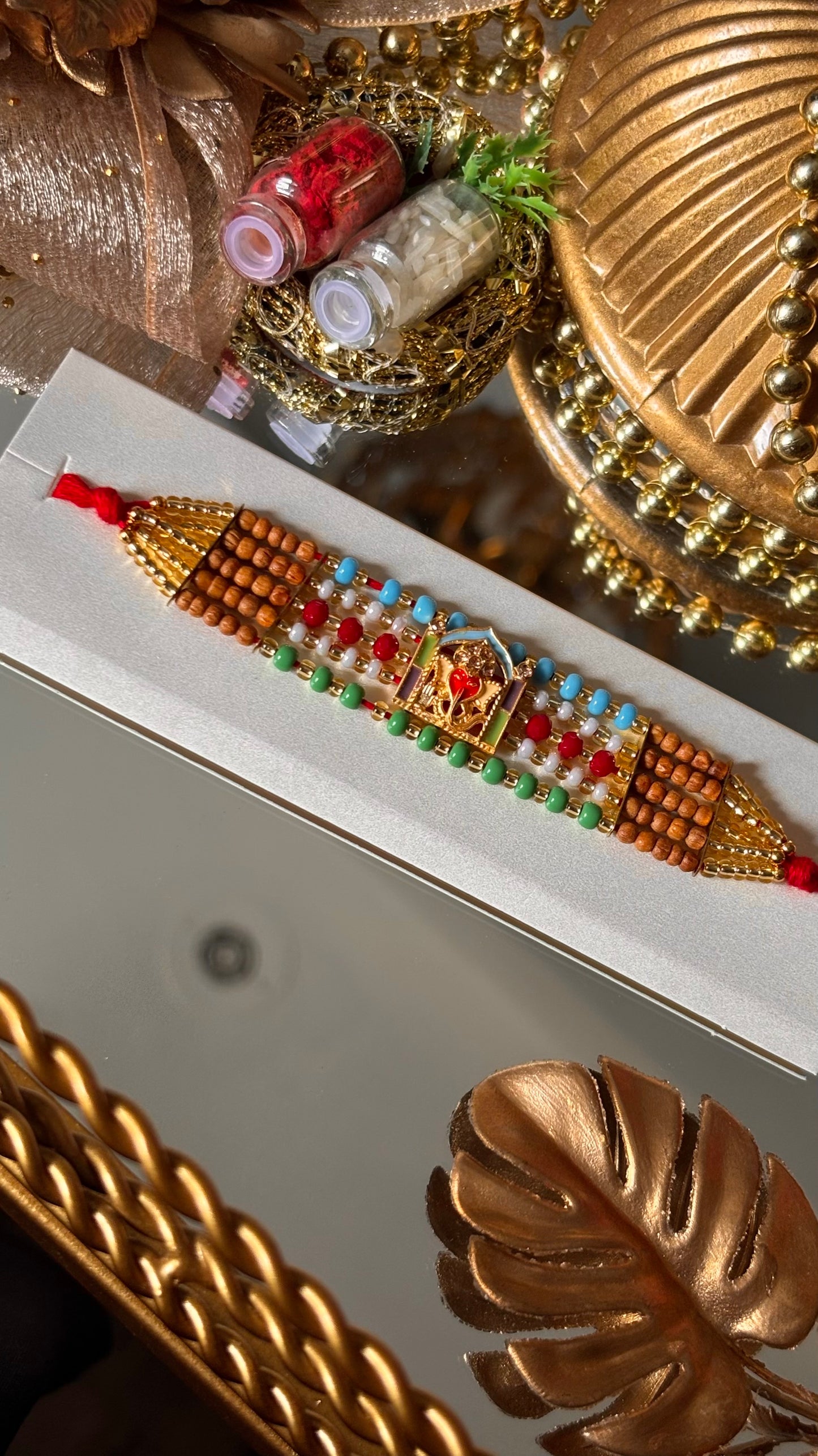 Lord ganesha multicoloured rakhi ( shipping will be extra )