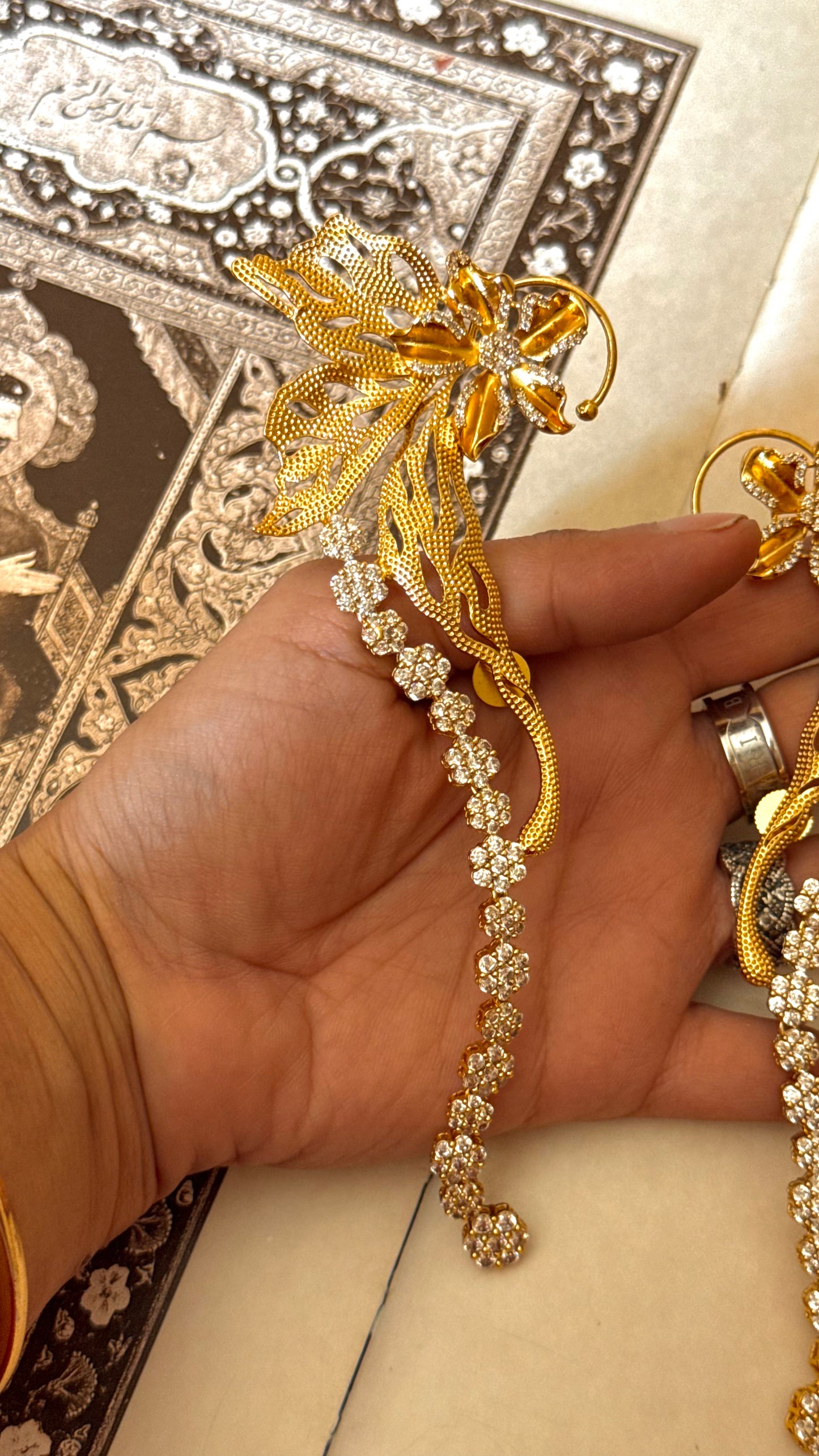 Designer Carnival ear cuff with floral diamond earrings
