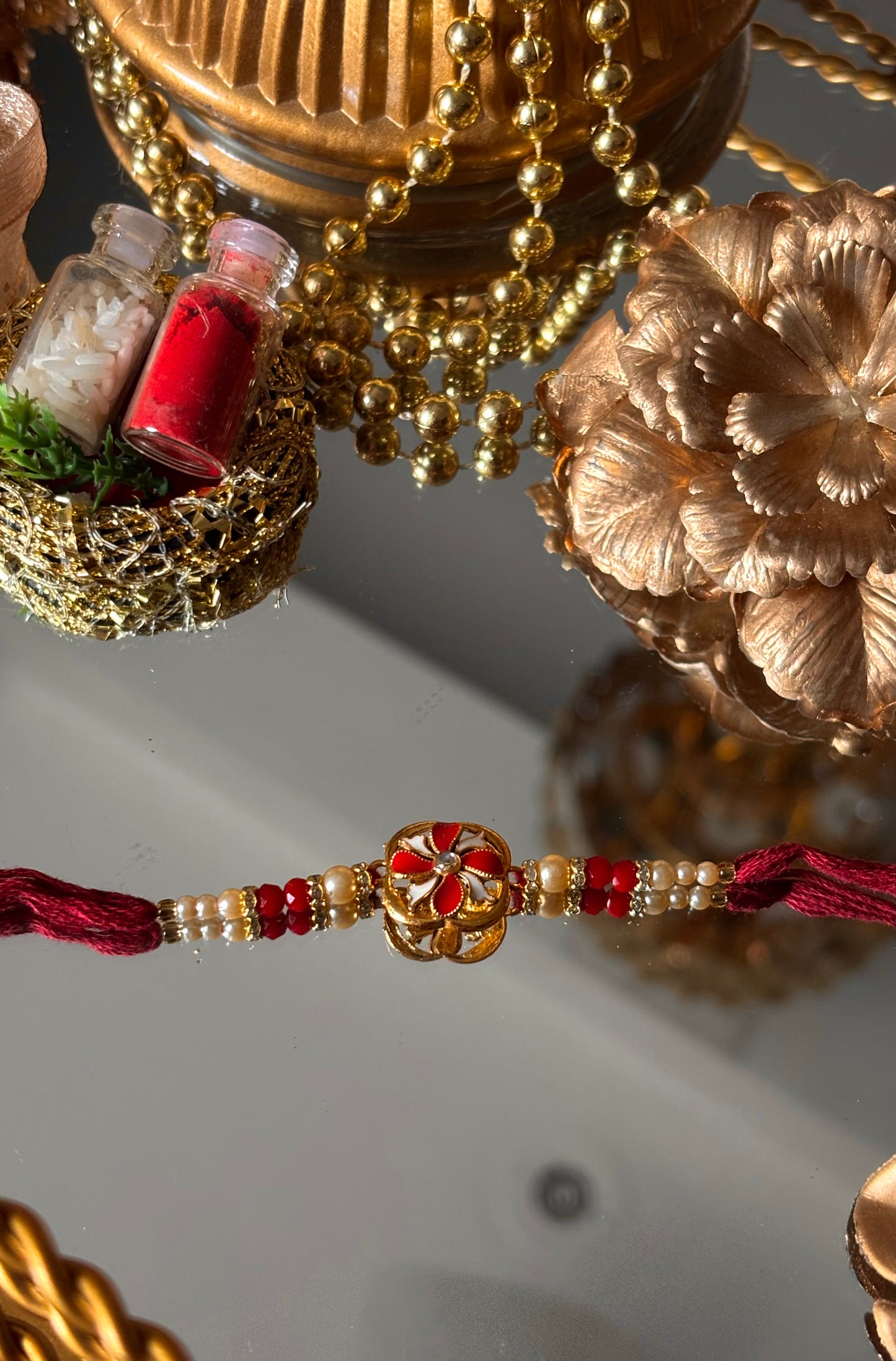Ruby meenkaari pearl floral rakhi ( shipping will be extra )