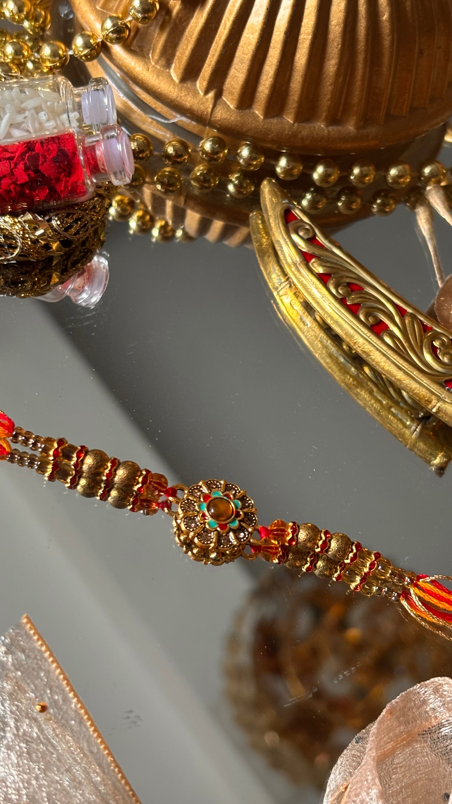 Floral hand painted nakashi oxidised gold Rakhi ( shipping will be extra )