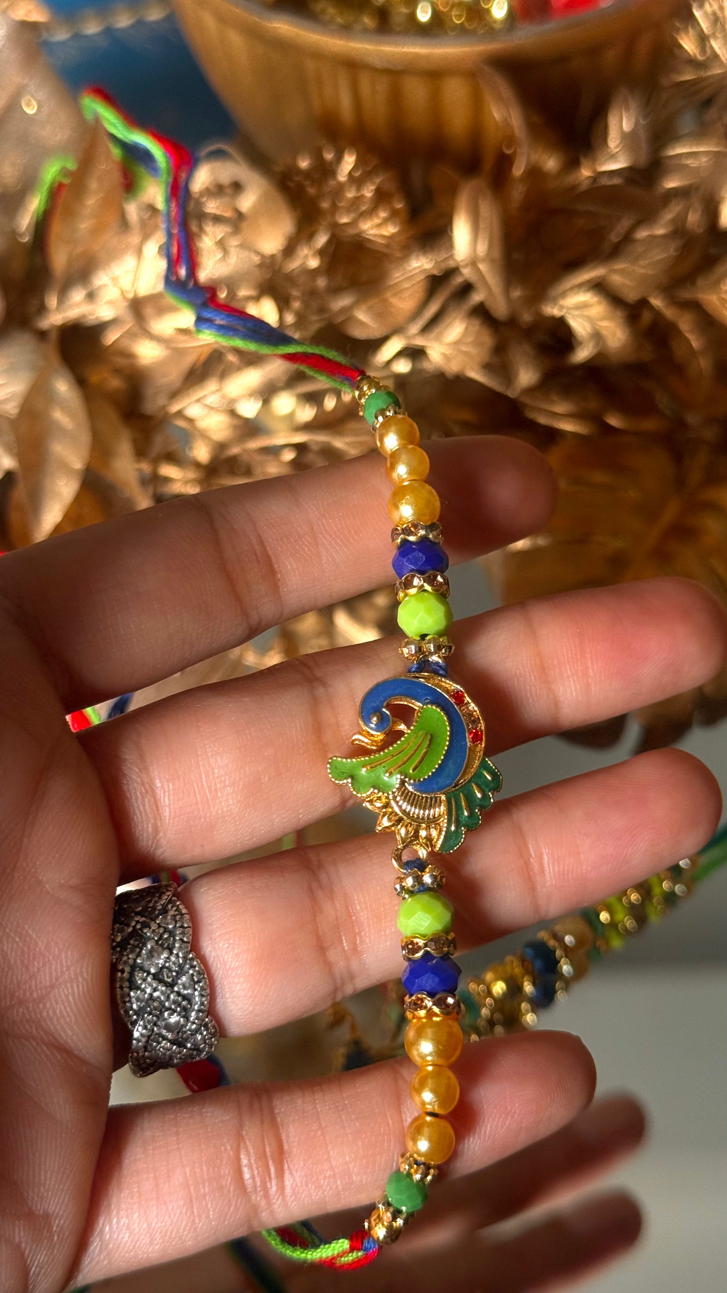 Peacock inspired nakashi rakhi