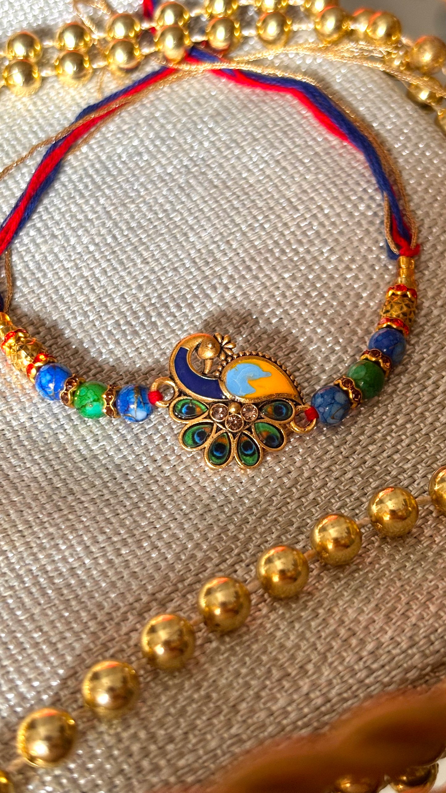 Peacock designer minimalist rakhi ( shipping will be extra )
