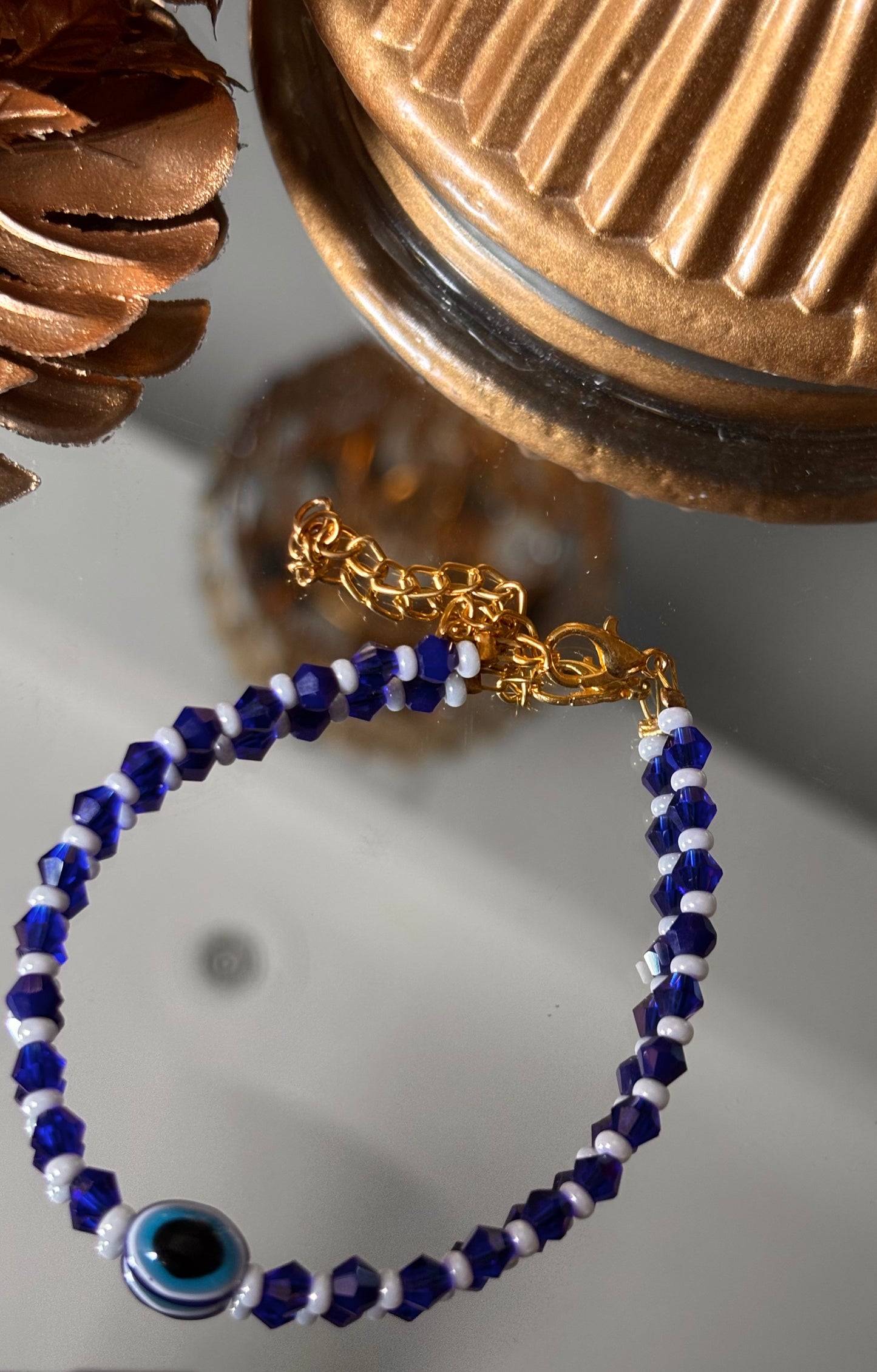 Evil eye sapphire rakhi ( shipping will be extra )