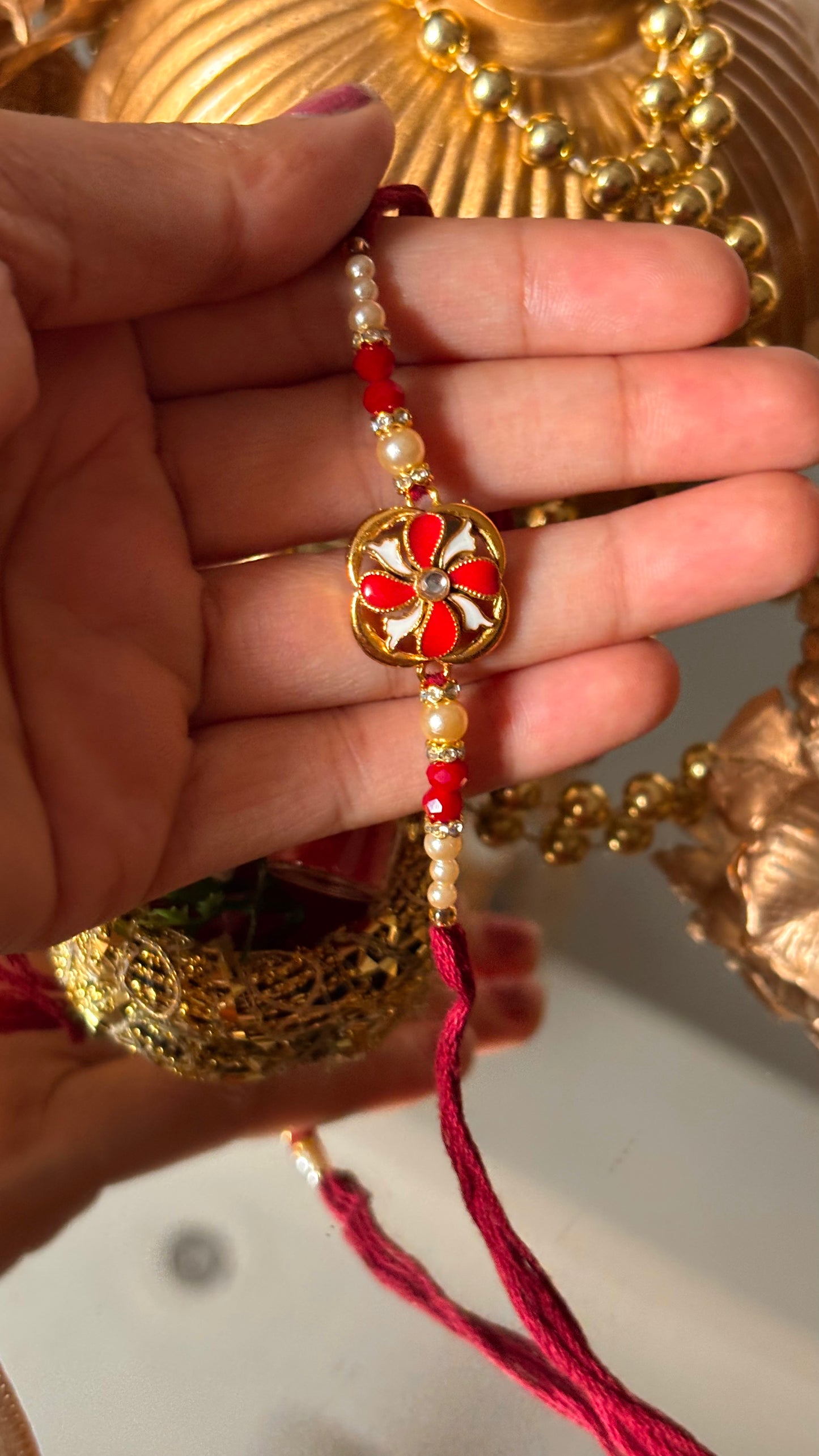 Ruby meenkaari pearl floral rakhi ( shipping will be extra )