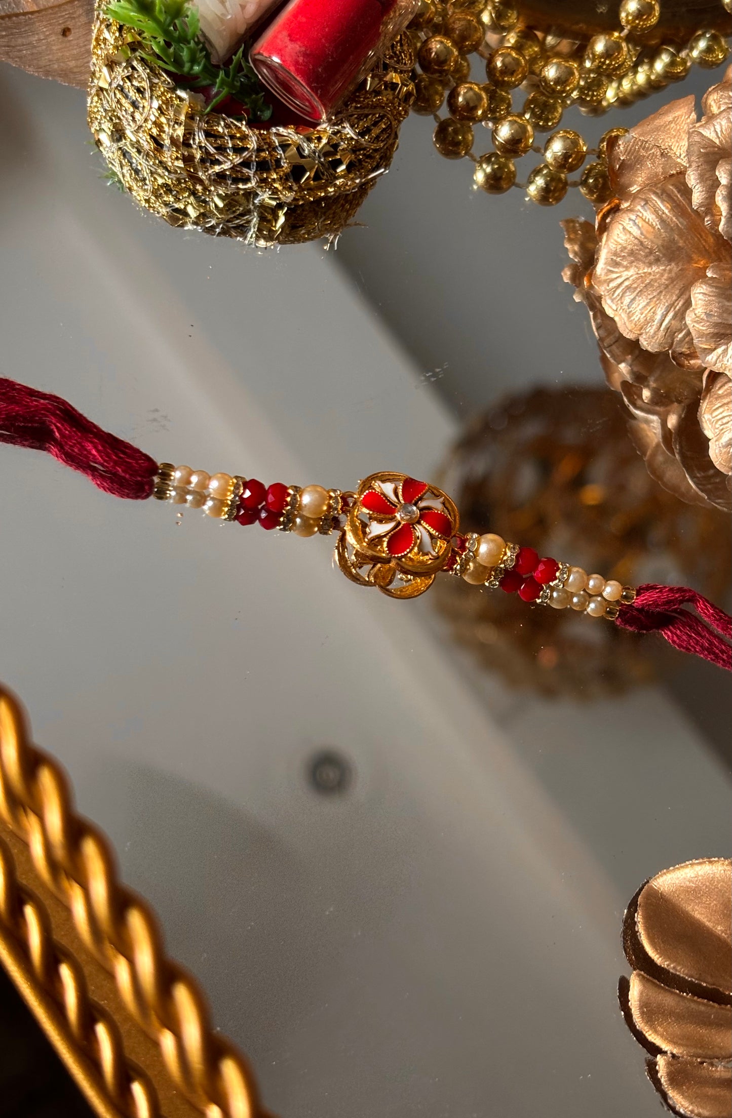 Ruby meenkaari pearl floral rakhi ( shipping will be extra )