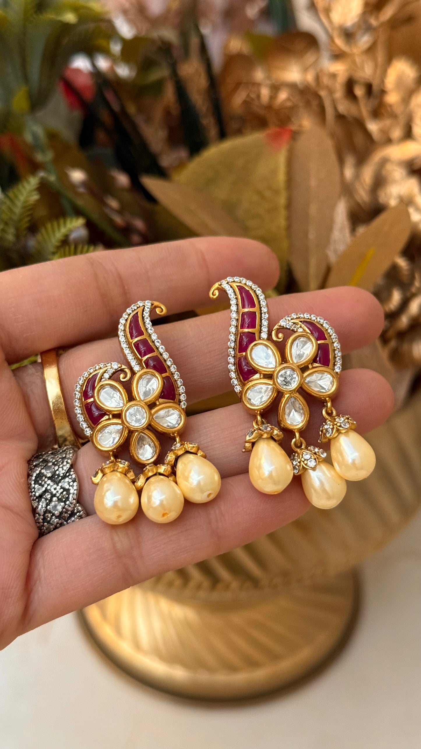 Designer Ruby takkar studs with floral pearl detailing