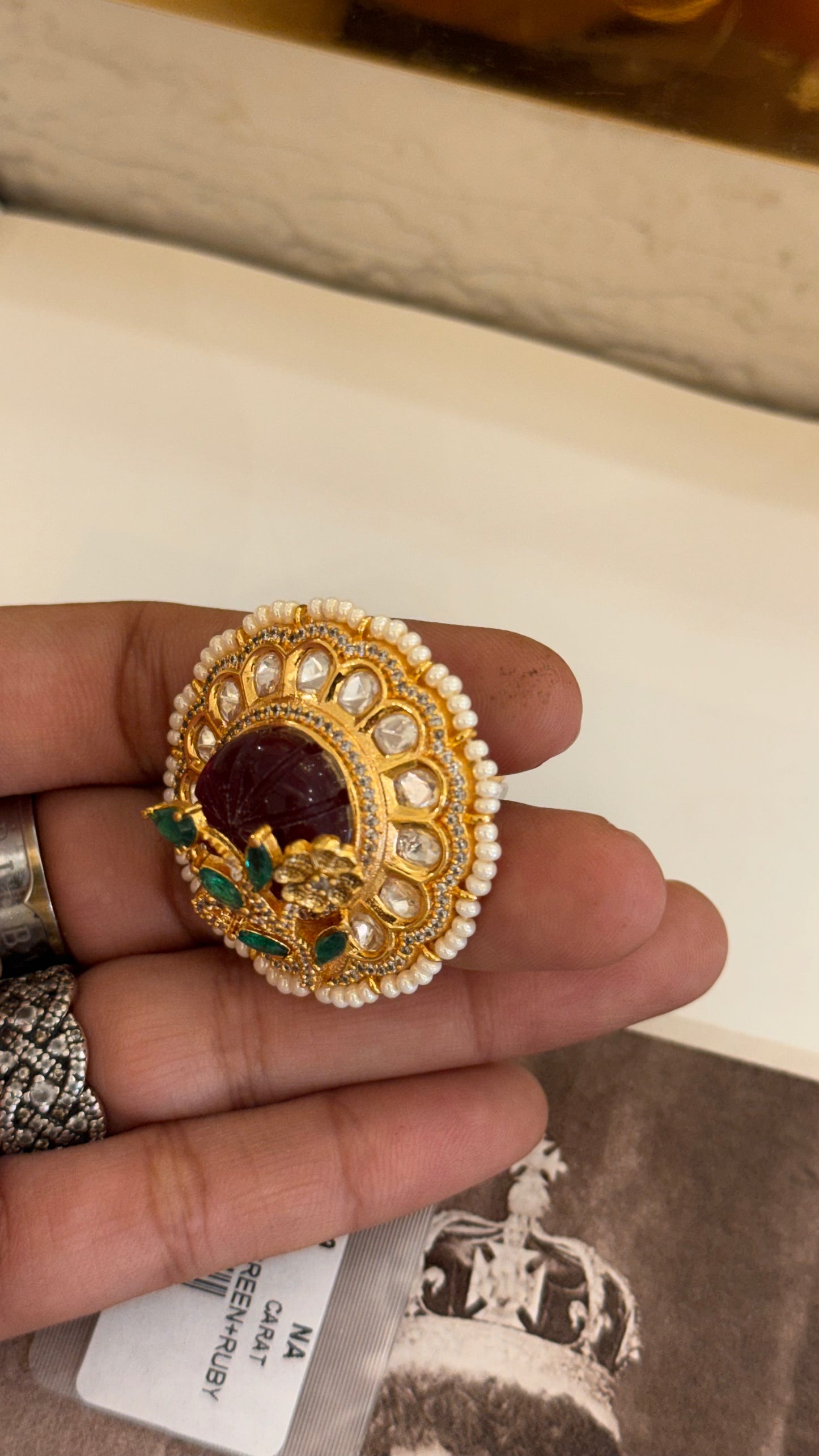 Ruby cocktail ring with leaf detailing