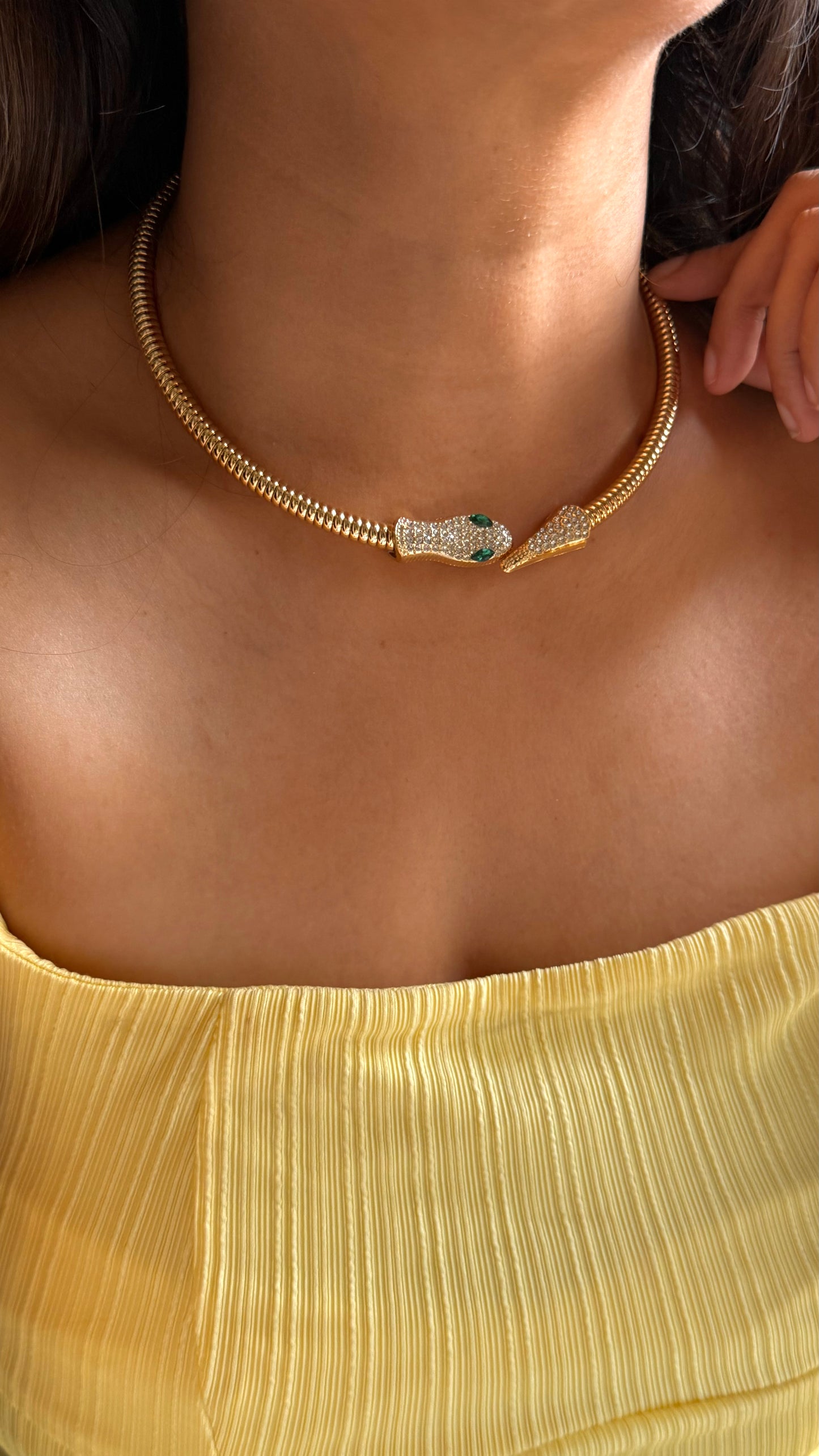Snake-head style choker with emerald eyes