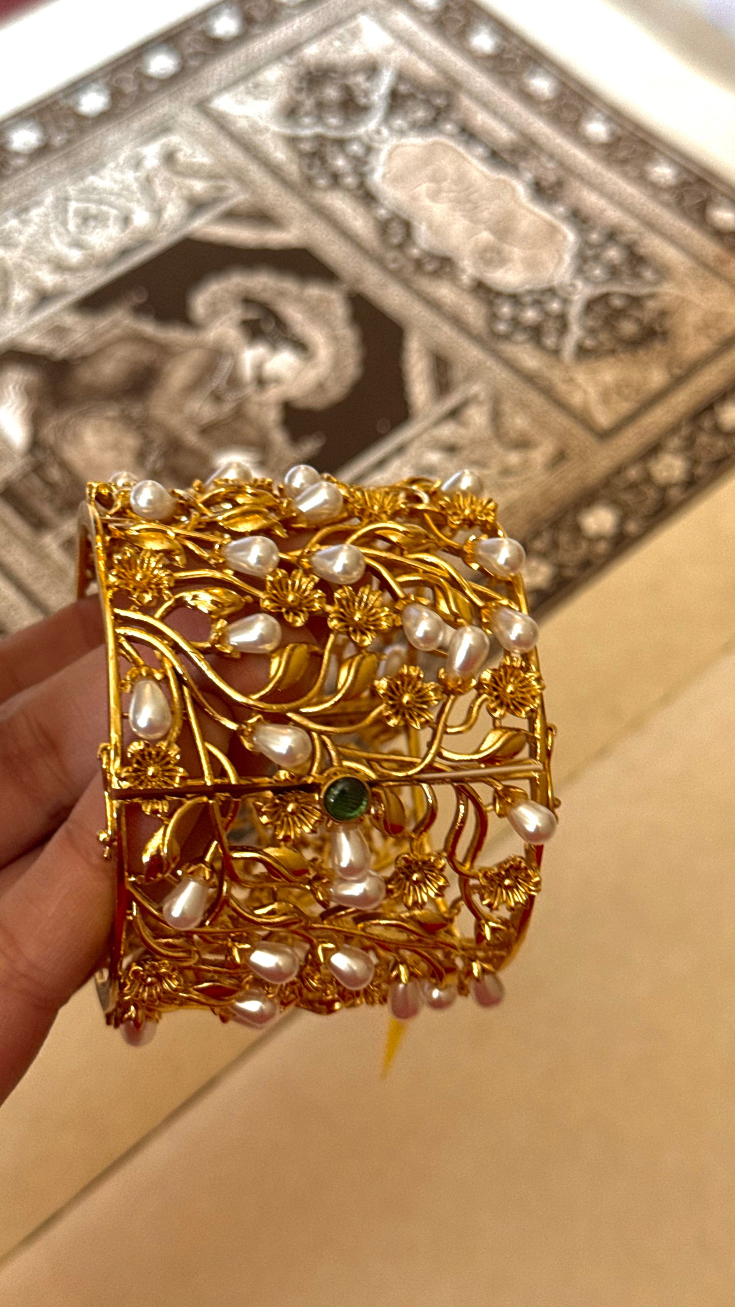 Pearl designer bracelet with gold Nakshi