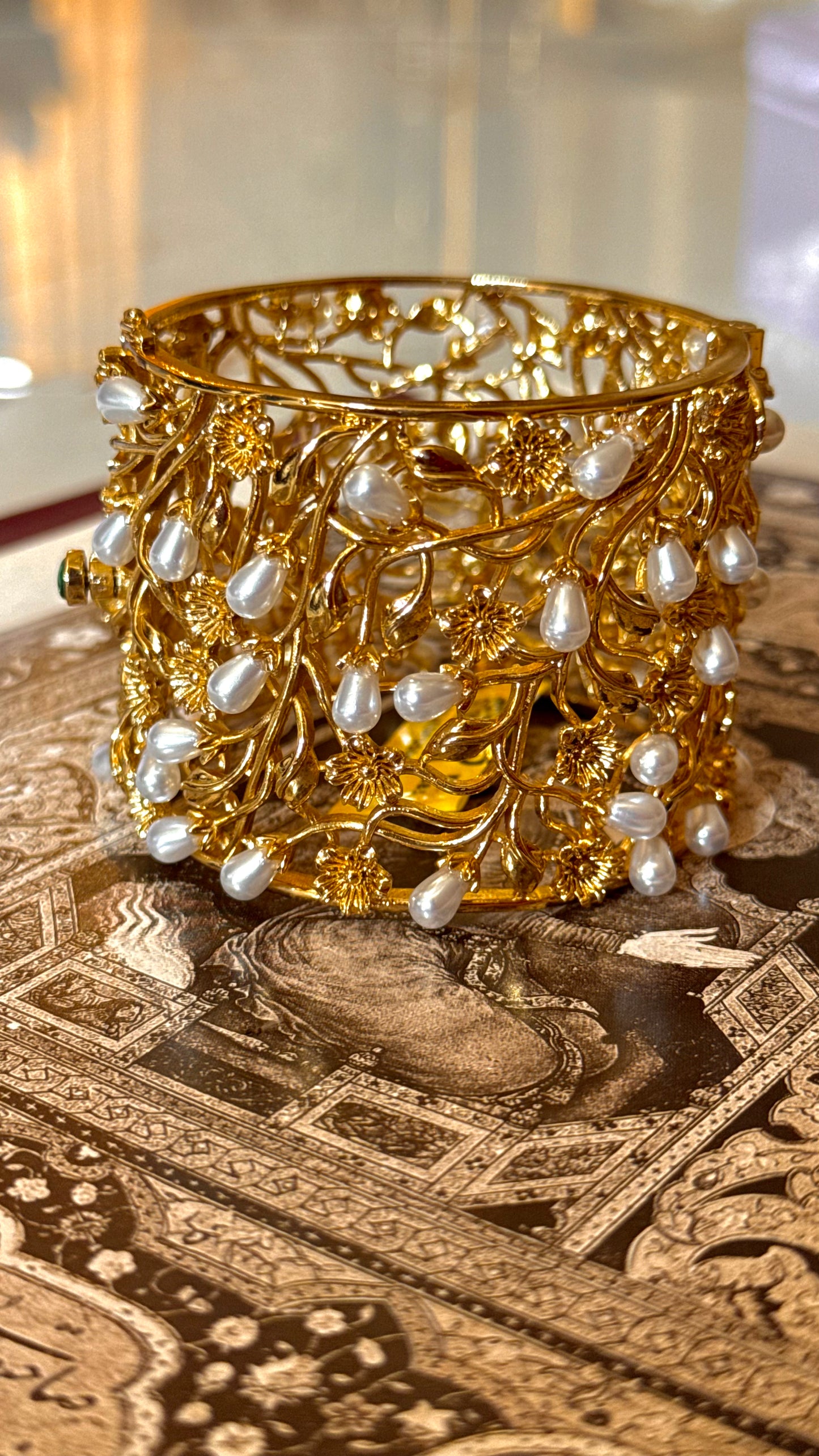 Pearl designer bracelet with gold Nakshi