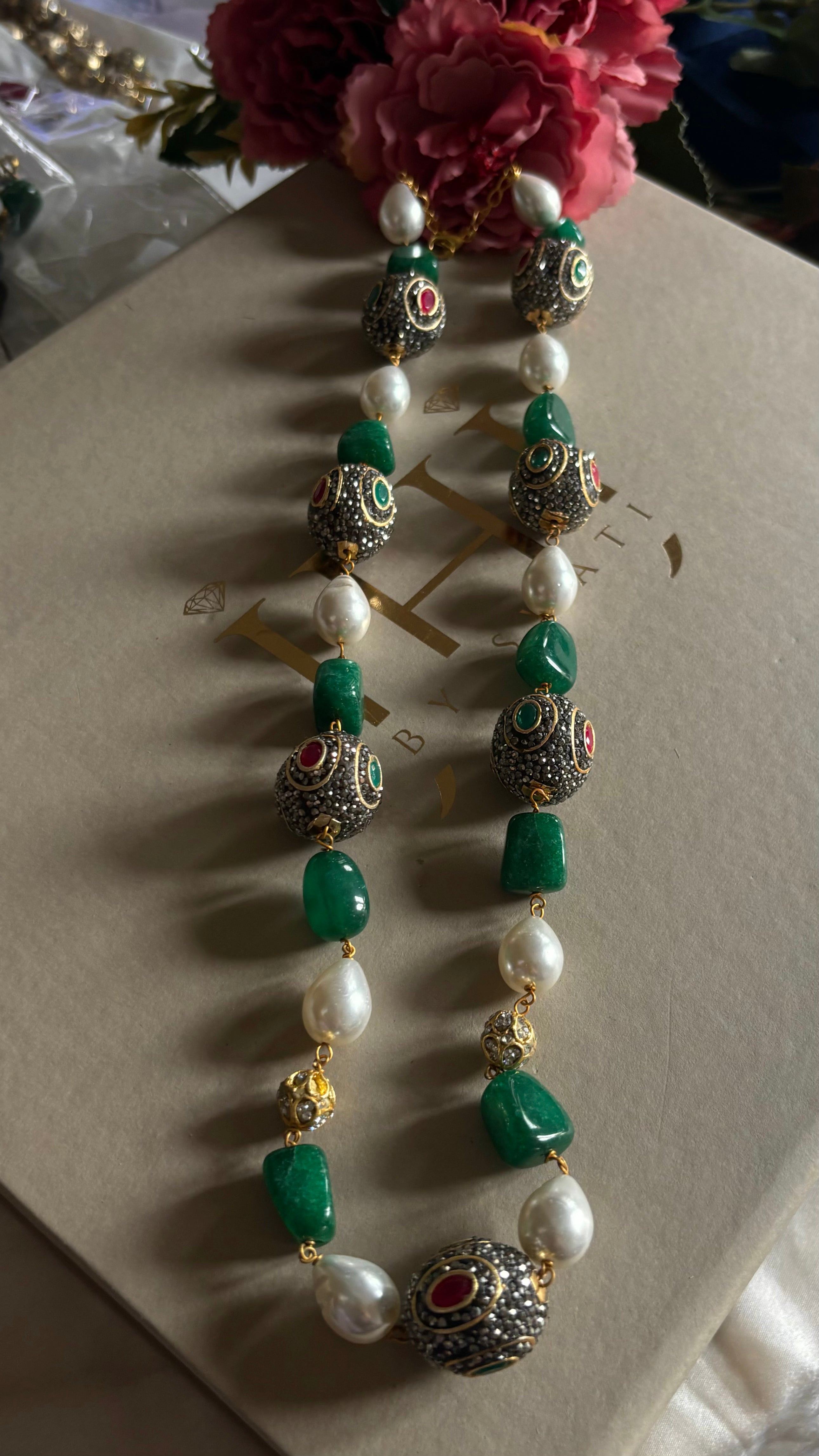 Emerald pearl and ruby string