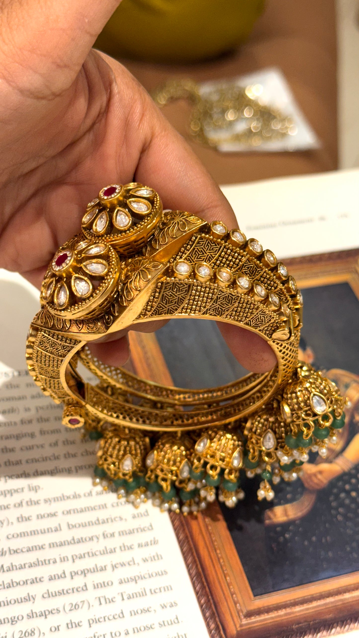 Rajwasa floral pattern bangles with rani pink stone and jhumki details