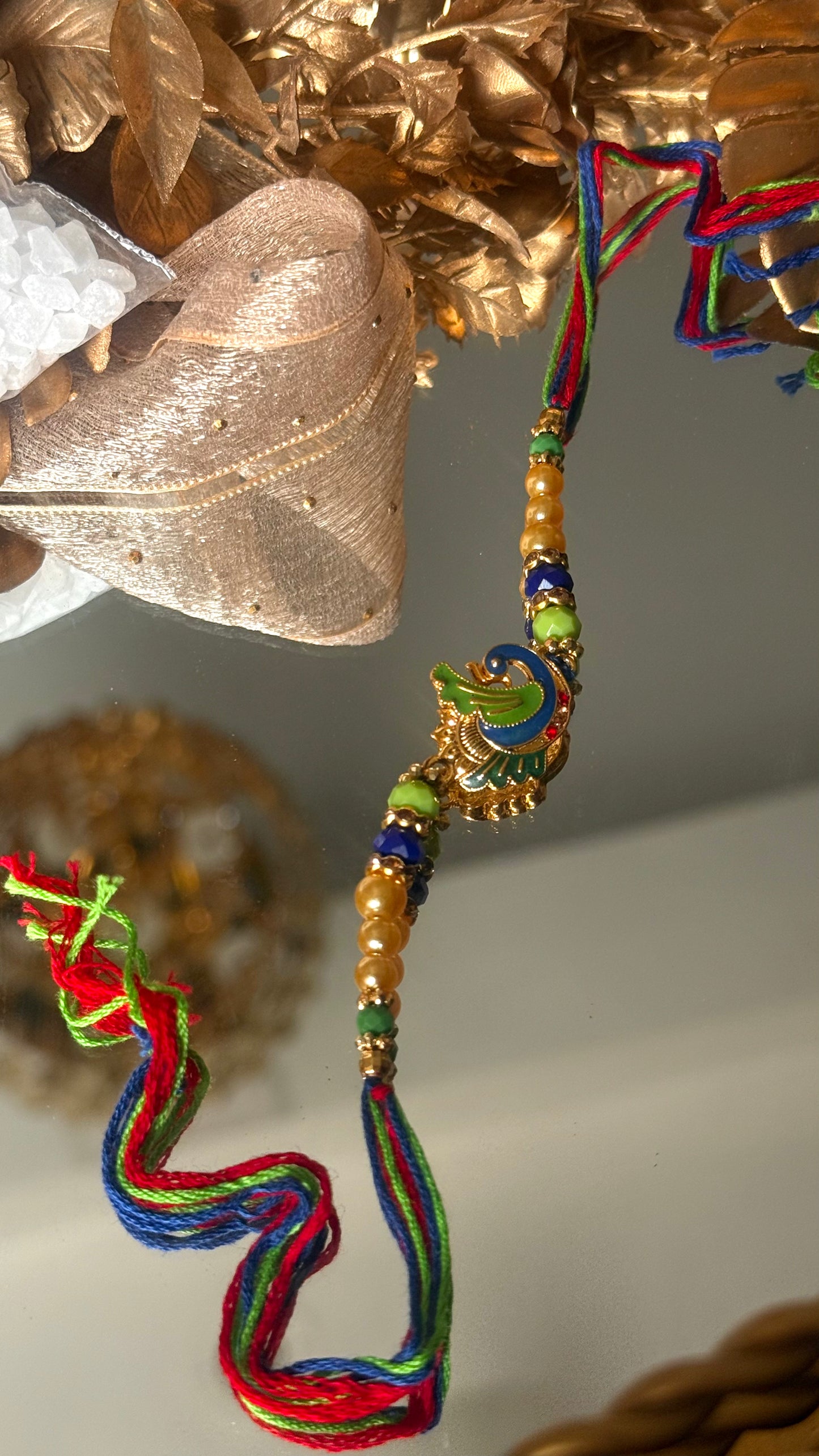 Peacock inspired nakashi rakhi