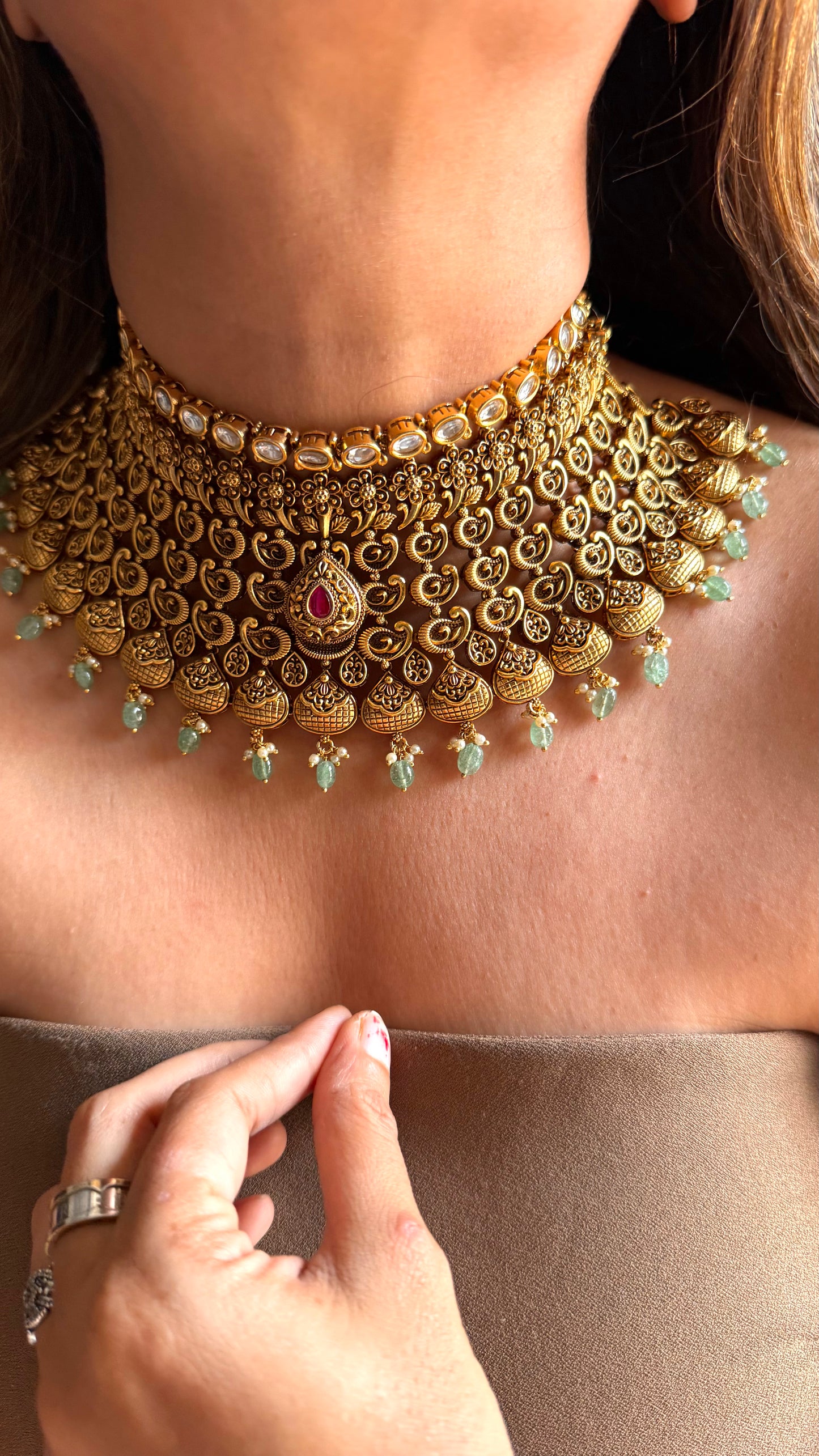 Ambi nakshi oxidised gold choker with ruby and mint detailing
