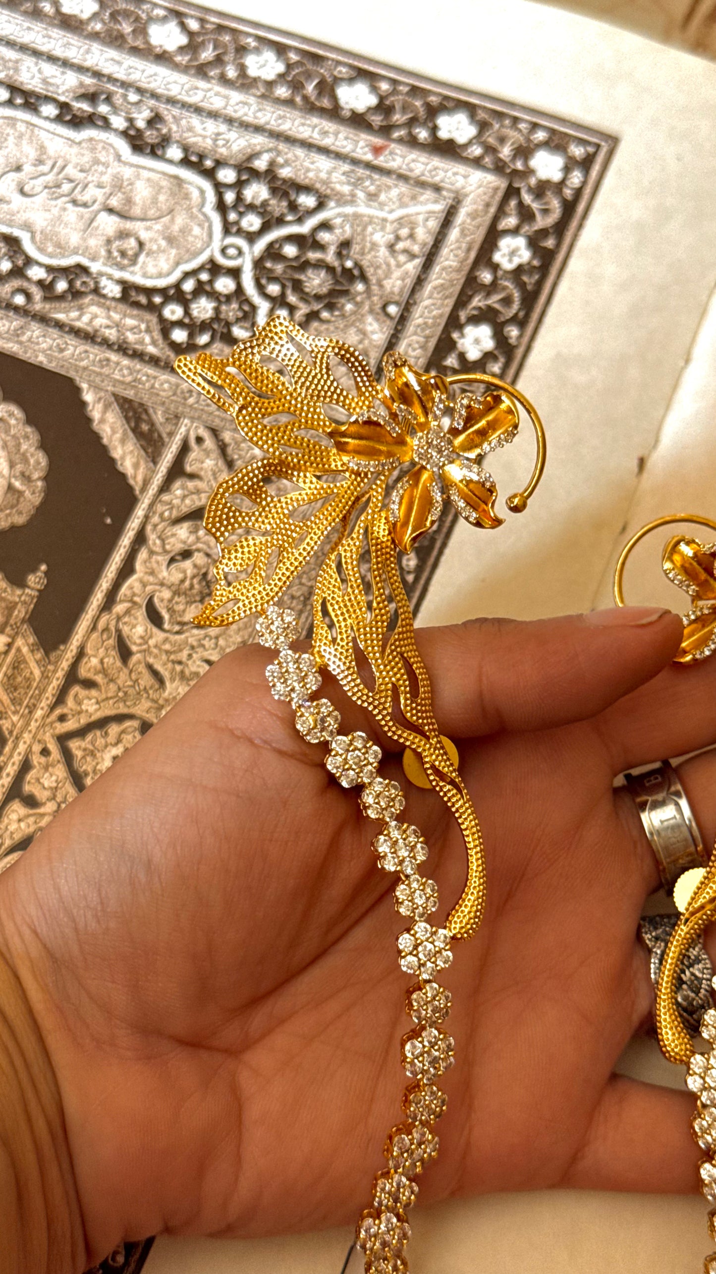 Designer Carnival ear cuff with floral diamond earrings