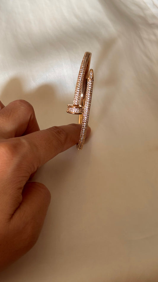 Crystal-Accented Nail rose gold tone bracelet