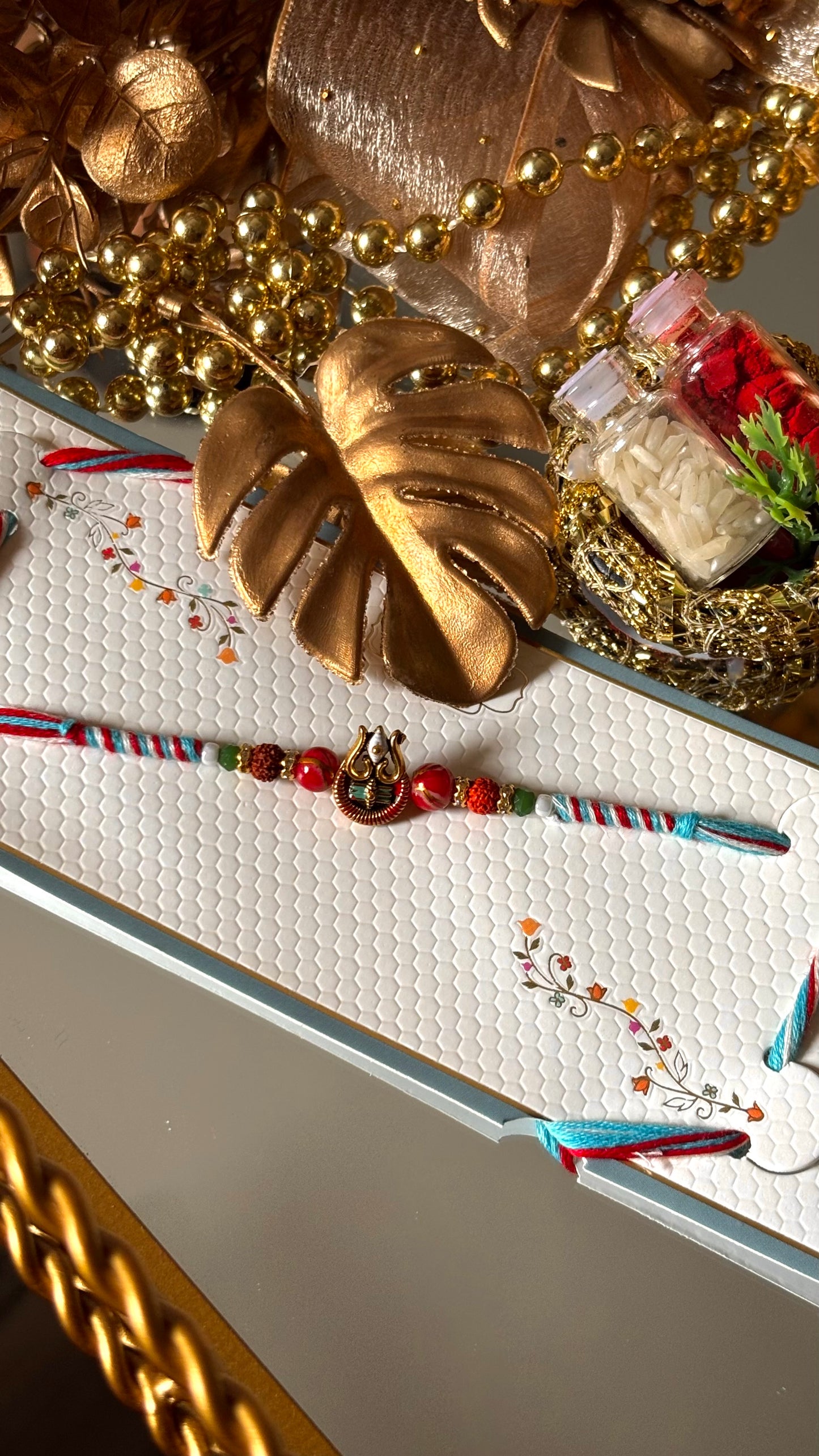 Lord shiva inspired rudraksh rakhi (red&blue) (shipping will be extra)