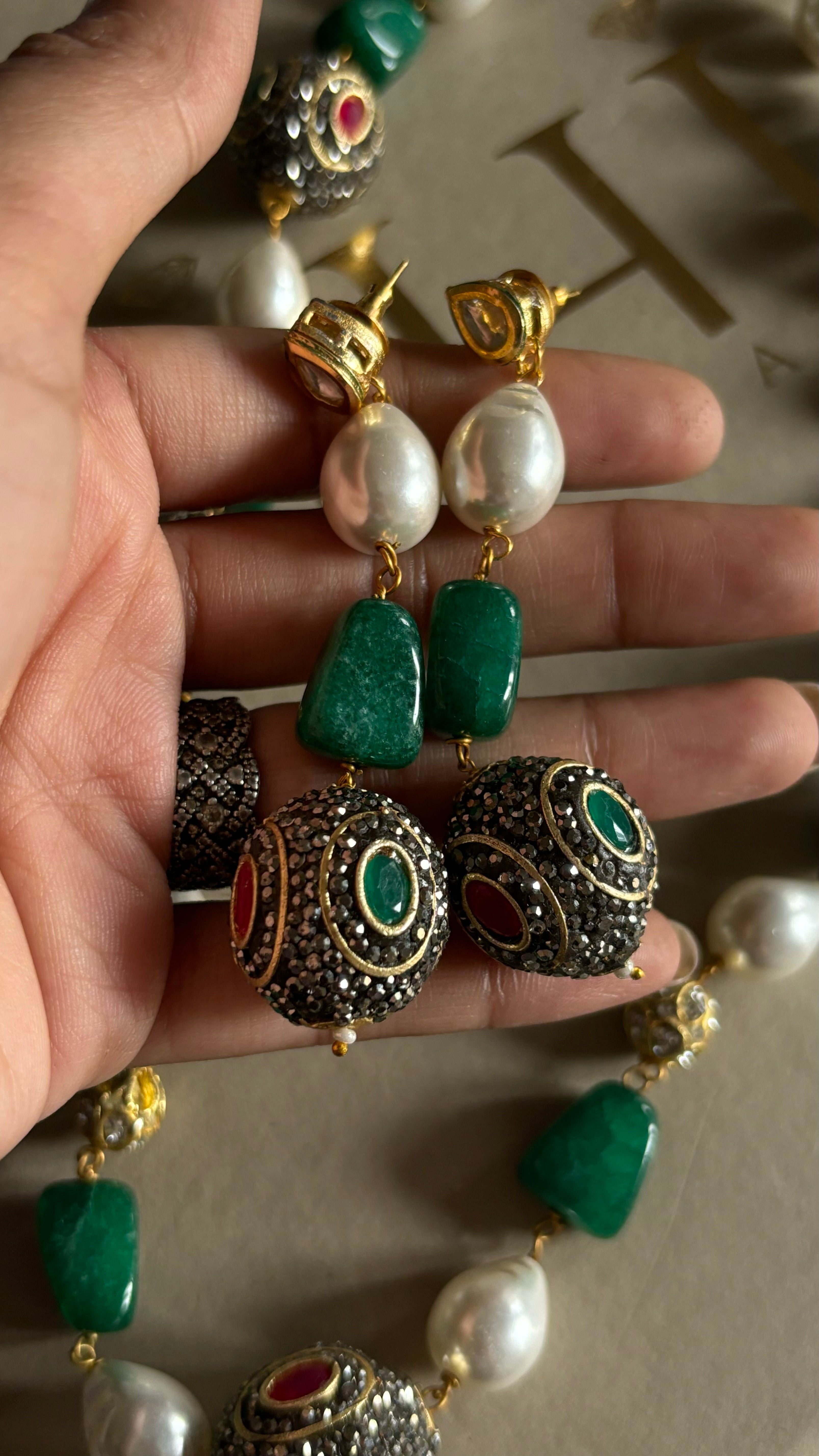 Emerald pearl and ruby string