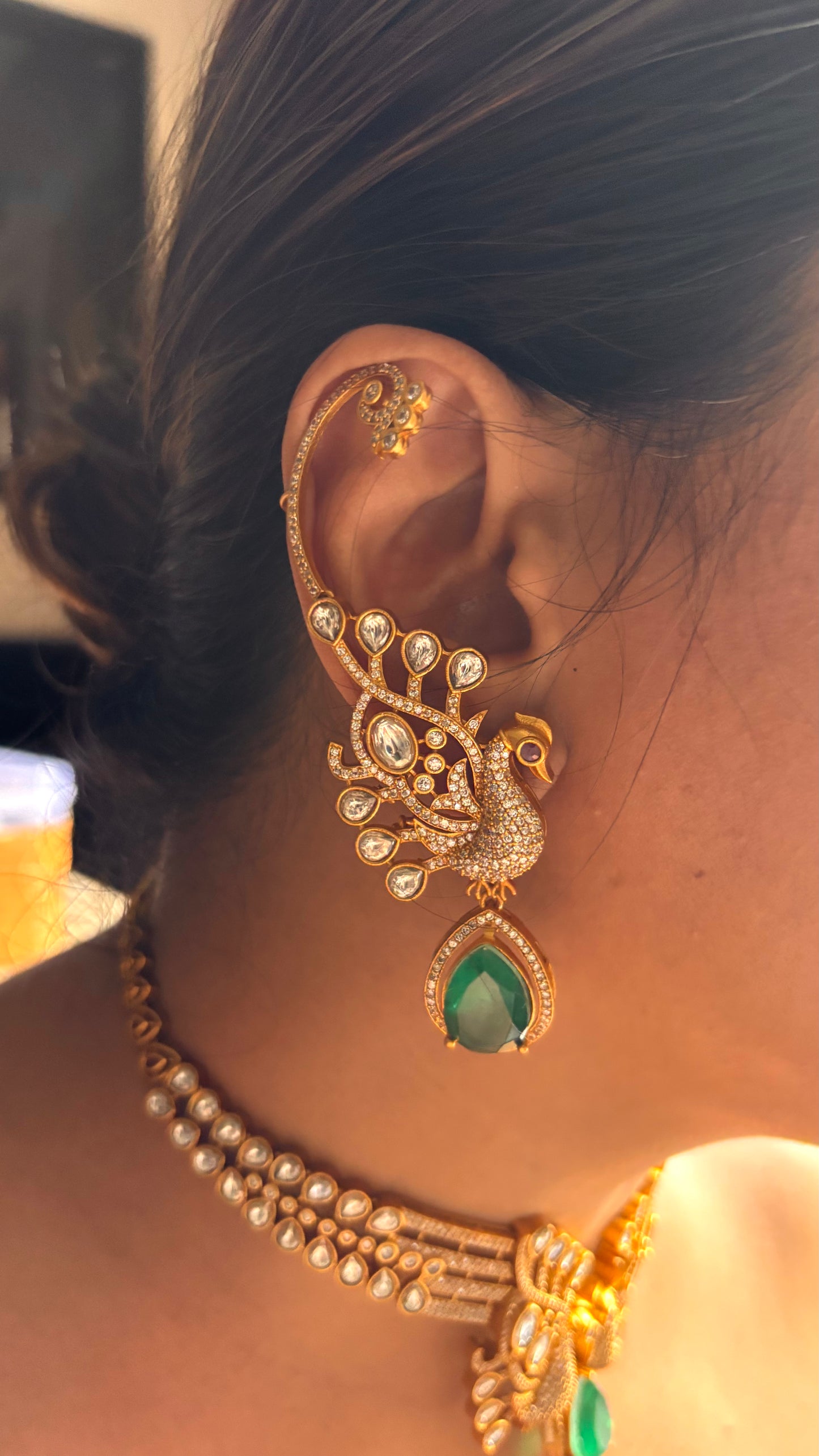 Peacock inspired contemporary emerald necklace with ear cuffs