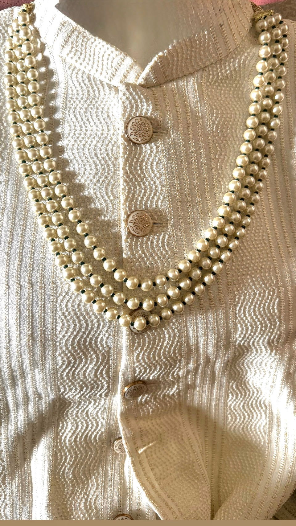Three line off white with emerald Pearl string
