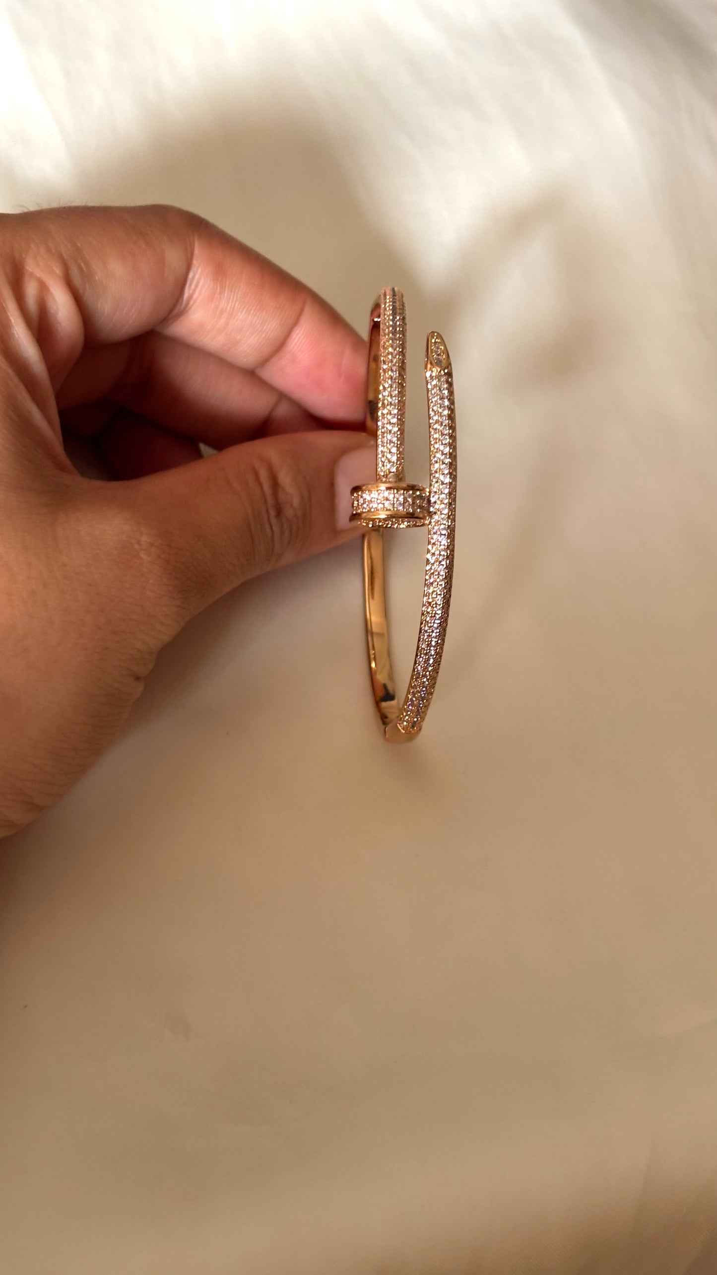 Crystal-Accented Nail rose gold tone bracelet