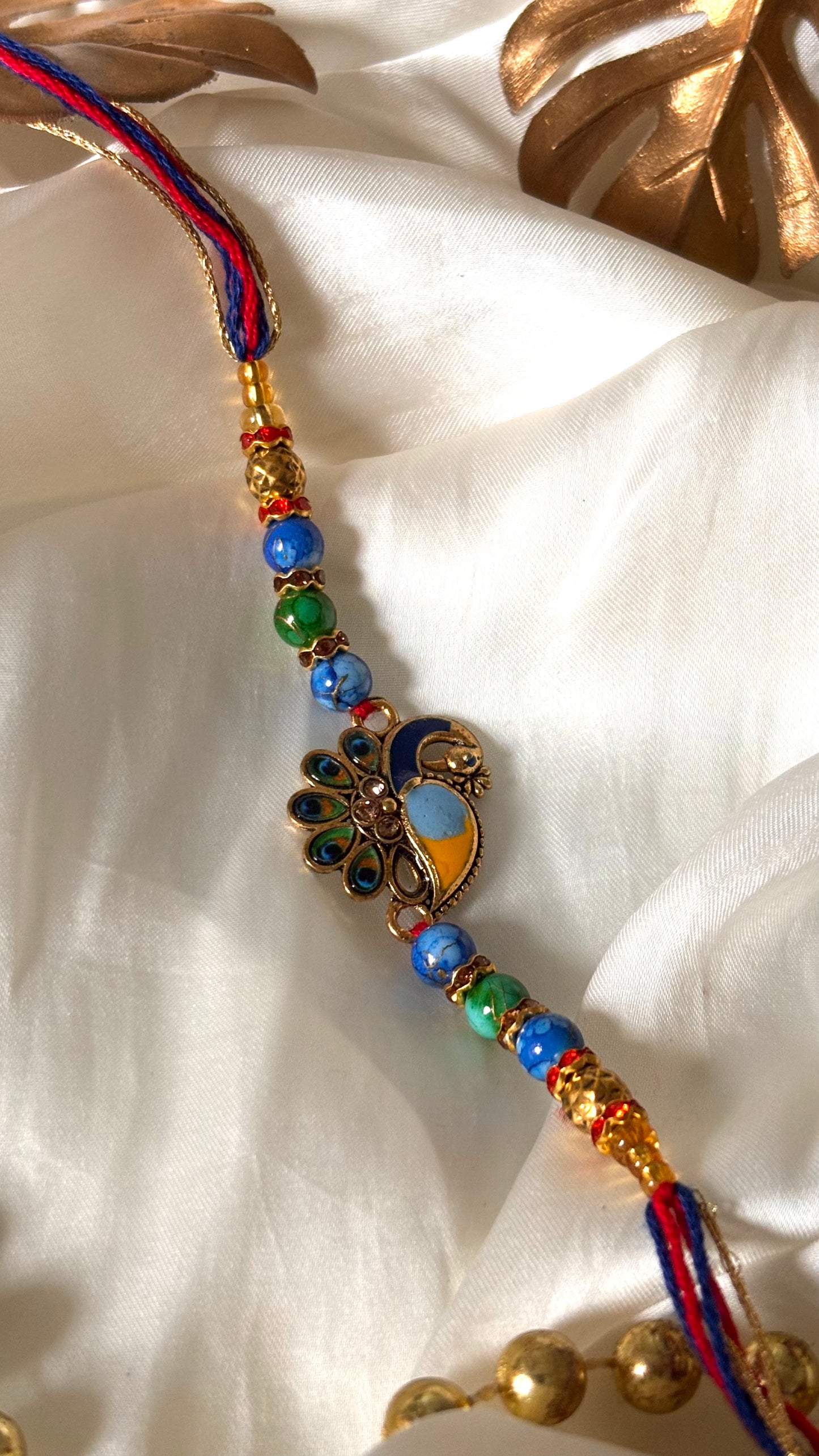 Peacock designer minimalist rakhi ( shipping will be extra )