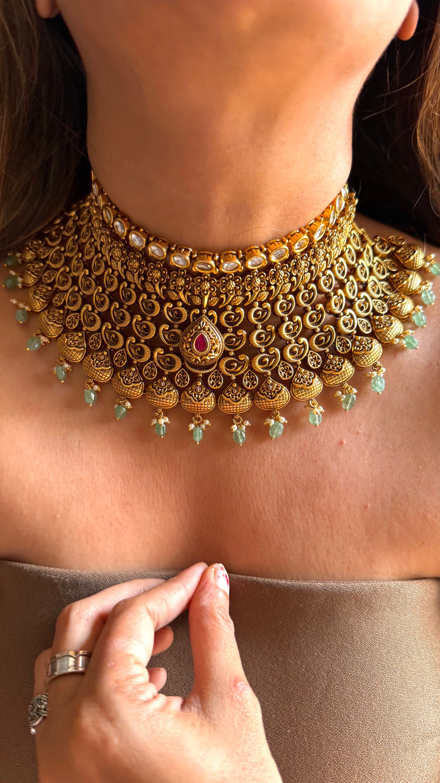 Ambi nakshi oxidised gold choker with ruby and mint detailing