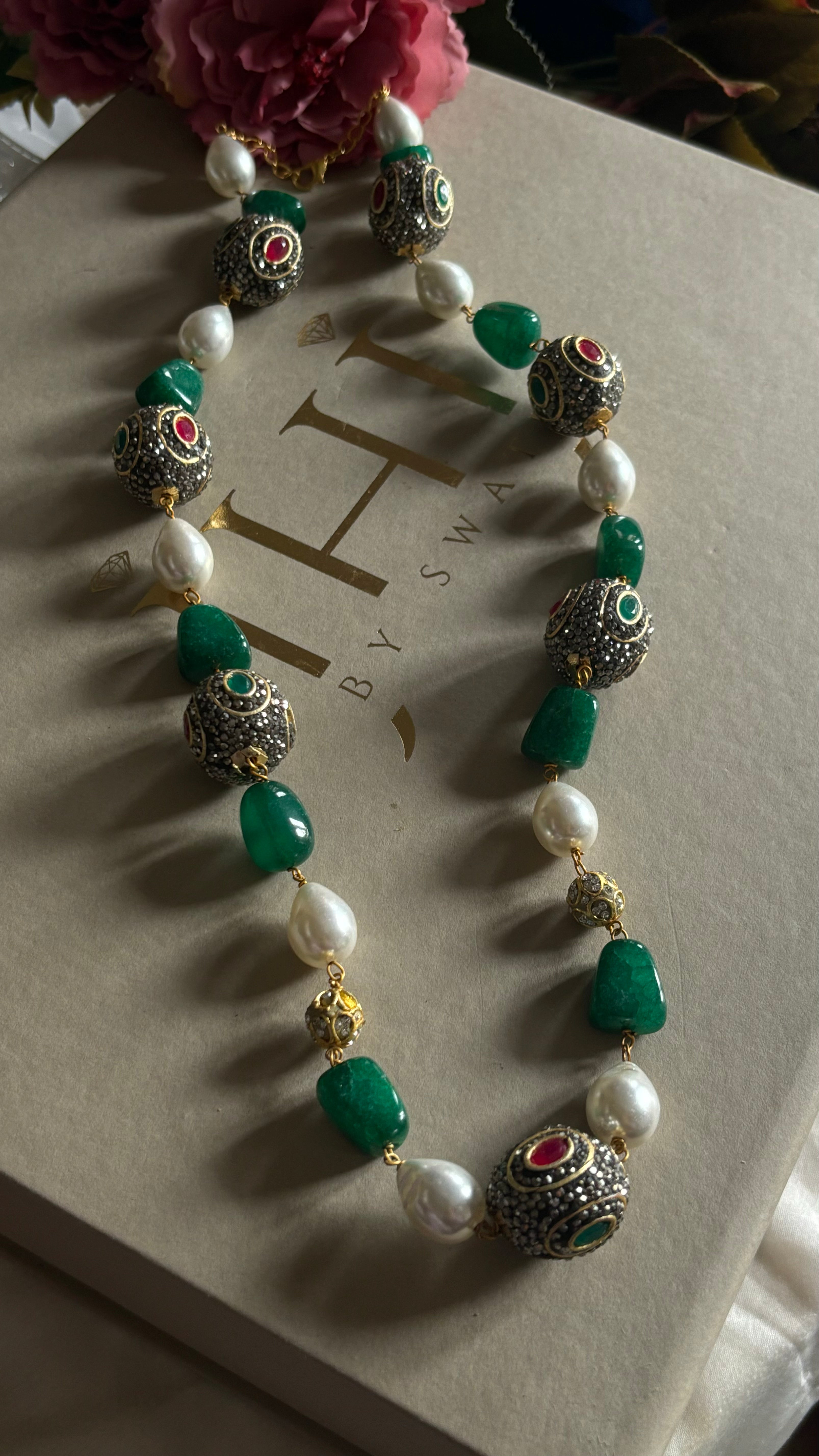 Emerald pearl and ruby string