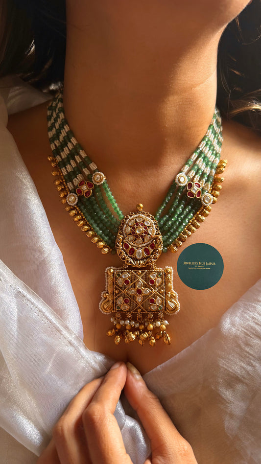 Rani pink with rajwada styled emerald set